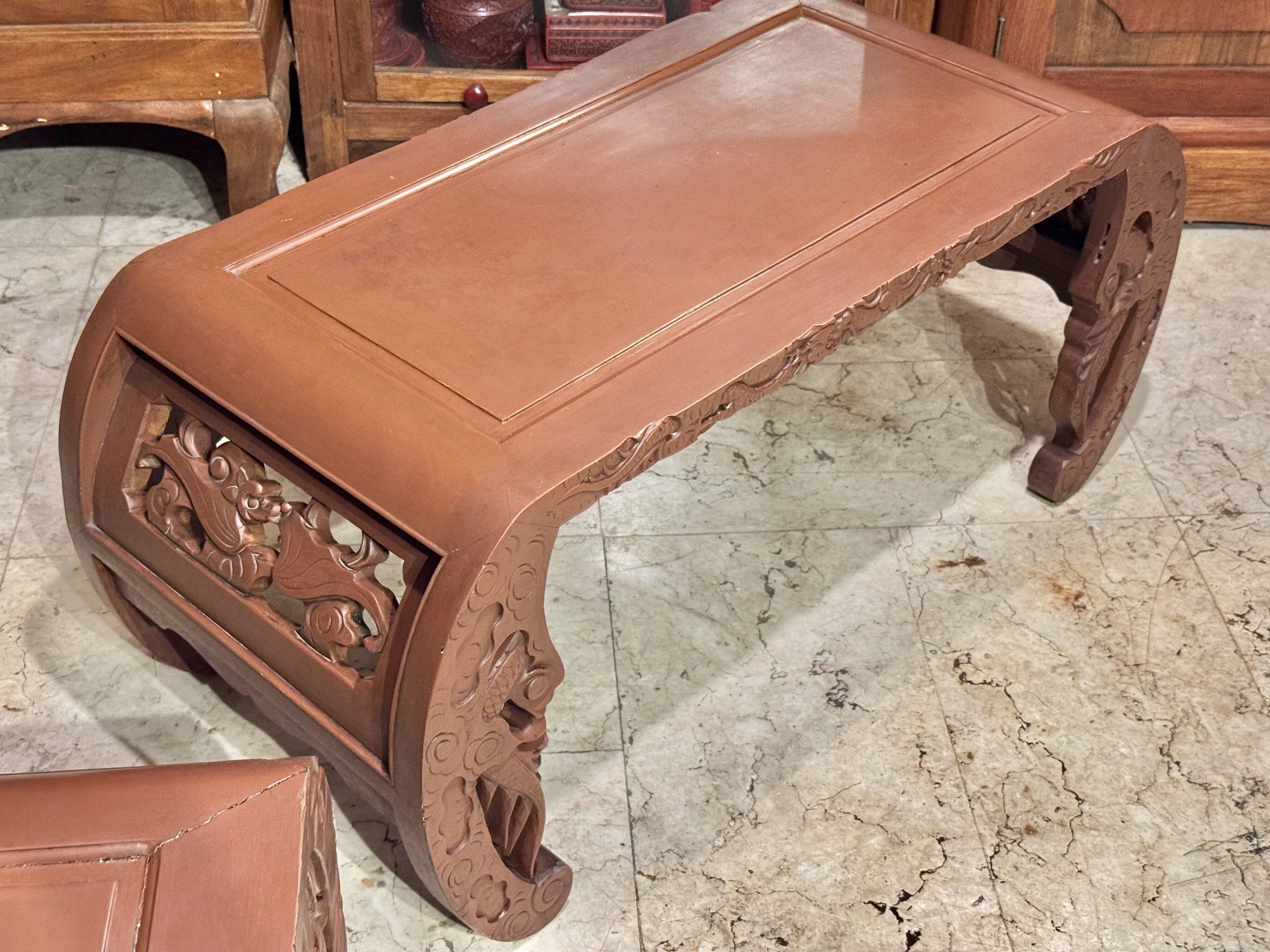 Vintage Narra Kang Tea Table (Category: Tables & Sets) located in Manila. Submitted by sinaunang_gamit (Listing ID 1417144065, Image 3). Description: Vintage Narra Kang Tea Table The tables feature intricate, hand-carved open-work designs, often depicting floral or leaf motifs. They are characterized by their low height and elegantly curved legs, known as “chow legs”. Length: 39 inches Height: 17.5 inches Width: 18 inches ₱8k each or 22k take all
