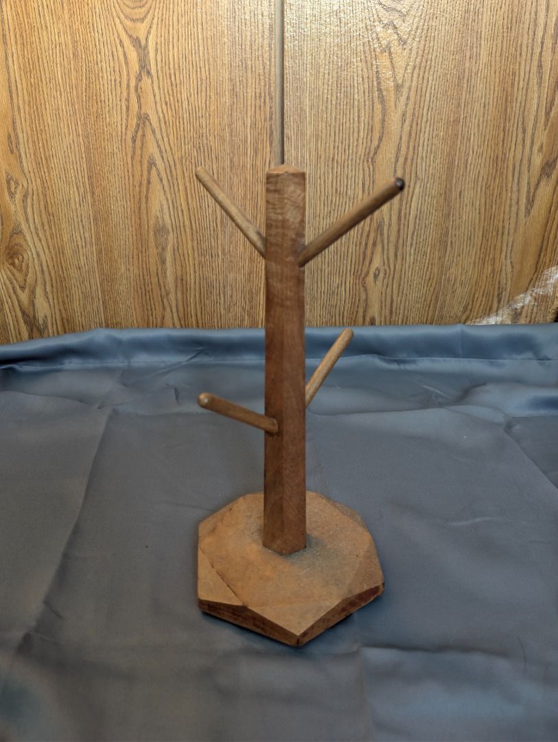 Wooden Mug Tree Holder (Category: Other Home Decor) located in Quezon City. Submitted by trainforless (Listing ID 1417139272, Image 1). Description: - Holds multiple mugs - Sturdy base - Natural wood finish - Adds a rustic touch - Perfect for kitchen or dining area.