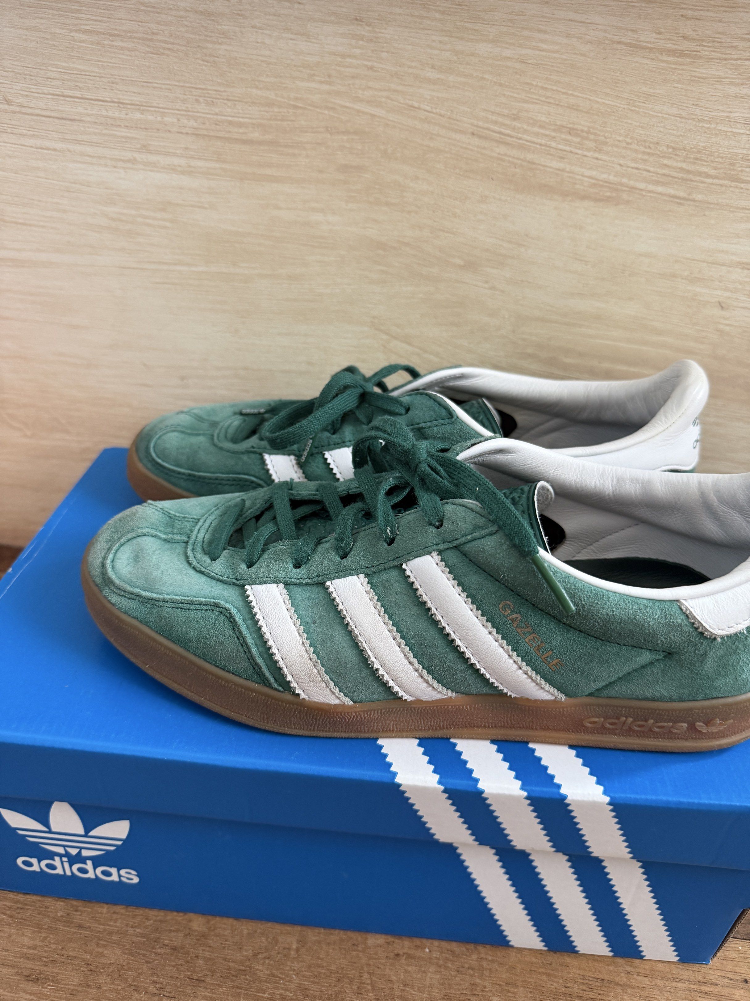 Adidas Gazelle Indoor Green (LAST PRICE) (Category: Sneakers) located in Kawit. Submitted by grazielaa (Listing ID 1417320644, Image 2). Description: - Adidas Indoor Gazelle - Suede - Runs Big - Extra laces (unused) - Color may vary due to lighting Issues: adidas insoles come off when you take them off but can be glued (see photos) & dead suede ‘cause it got wet :( RFS: decluttering MOP: Gcash and BDO Don’t hesitate to message me if you have any 
