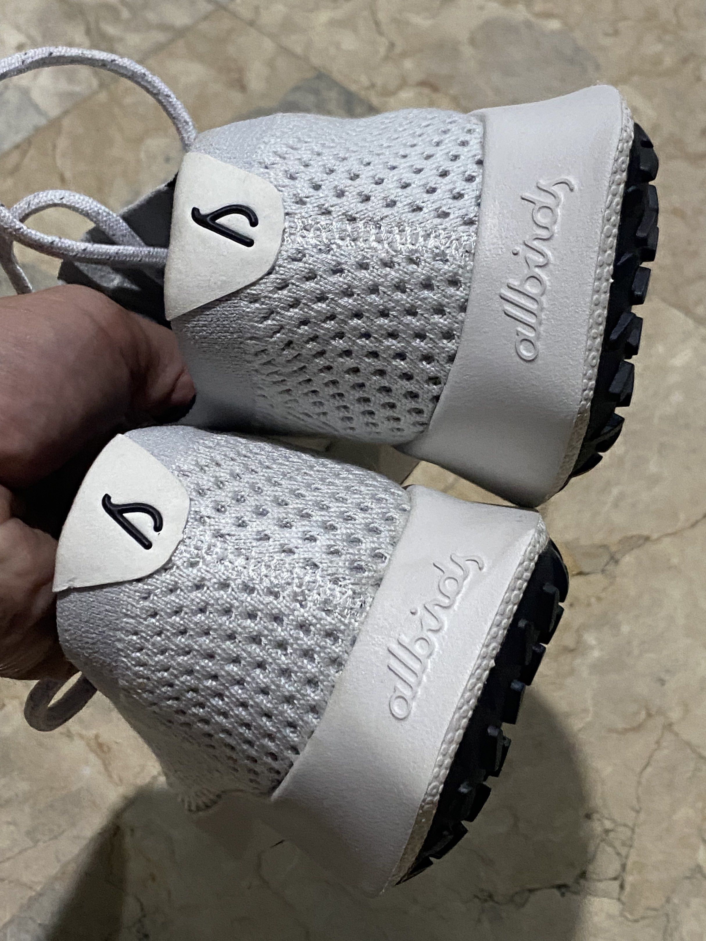 Allbirds Women's Tree Dasher 2 (Category: Sneakers) located in Pasig City. Submitted by neka2017 (Listing ID 1417280309, Image 3). Description: - Allbirds Women's Tree Dasher 2 sneakers - Color: Light Grey - Sole: White - Eyelets: Dark Blue - Size: US 10, UK 7-7.5, EU 40 - Made in Vietnam - Features a breathable knit upper - Cushioned sole for comfort - Allbirds logo on heel.