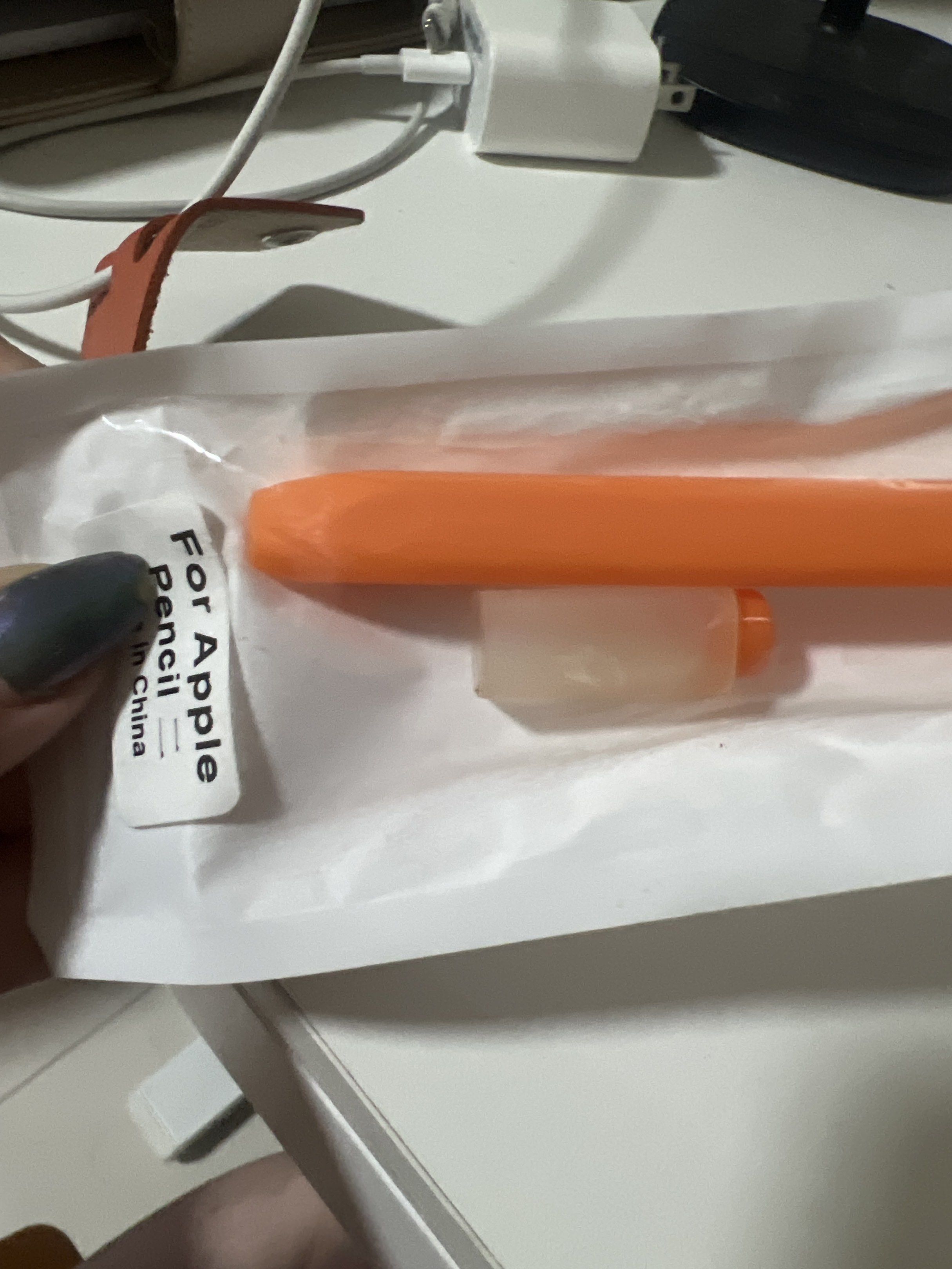 Apple Pencil Pro Case - Orange (Category: Other Accessories) located in Mandaluyong City. Submitted by mnlmeetup (Listing ID 1417332999, Image 2). Description: - Orange silicone case for Apple Pencil - Includes a cap holder - Protects your Apple Pencil from scratches and damage - Easy to install and remove - Provides a comfortable grip - Designed to fit the Apple Pencil perfectly Brand new. Compatible to apple pencil pro.