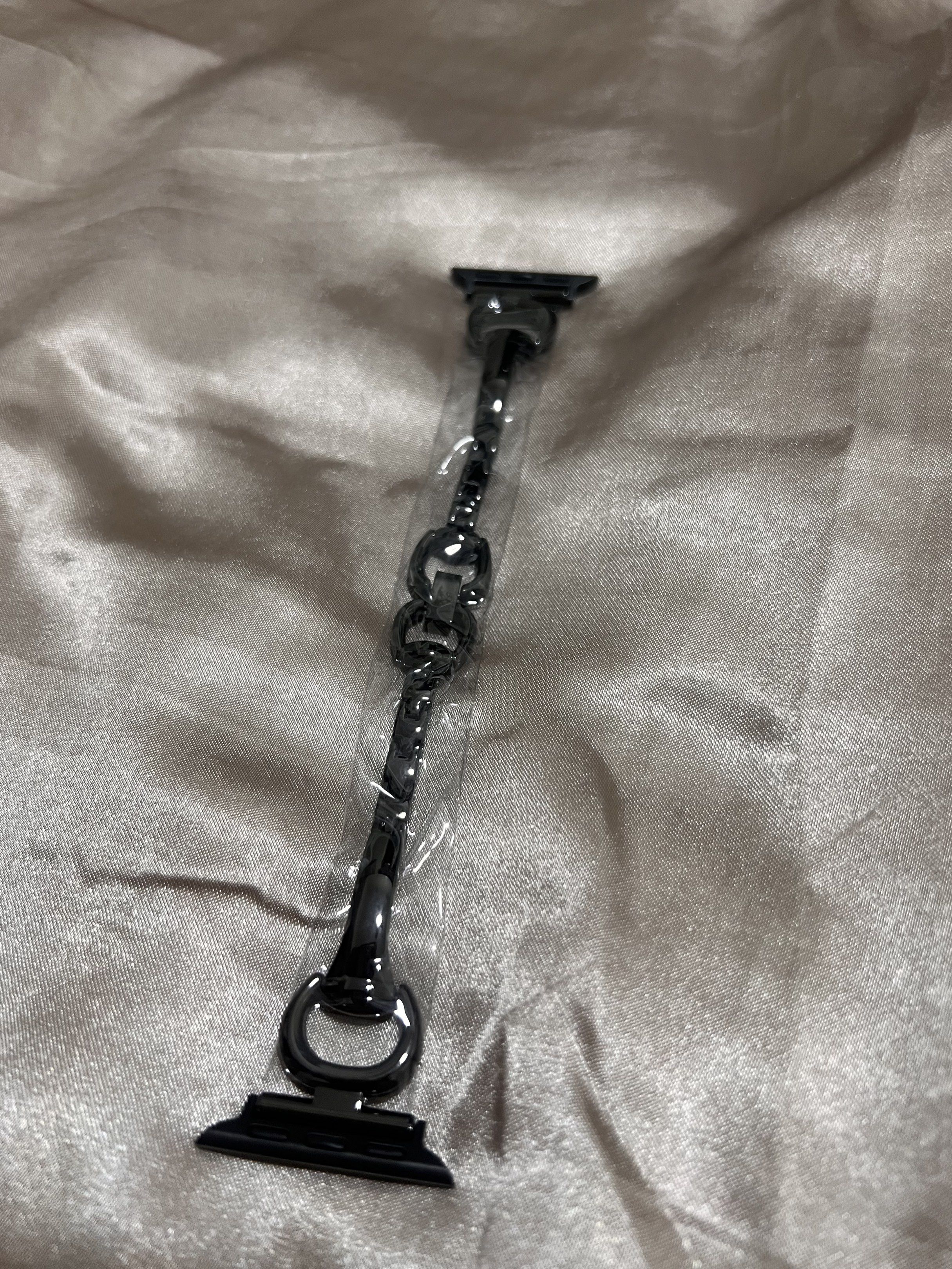 Apple Watch Strap 38mm/40mm/41mm Black (Category: Women's Watches) located in Mandaluyong City. Submitted by mnlmeetup (Listing ID 1417335372, Image 2). Description: - Black watch strap for Apple Watch - Fits 38mm, 40mm, and 41mm models - Stylish chain link design - Brand new, still in original packaging - Made in China.