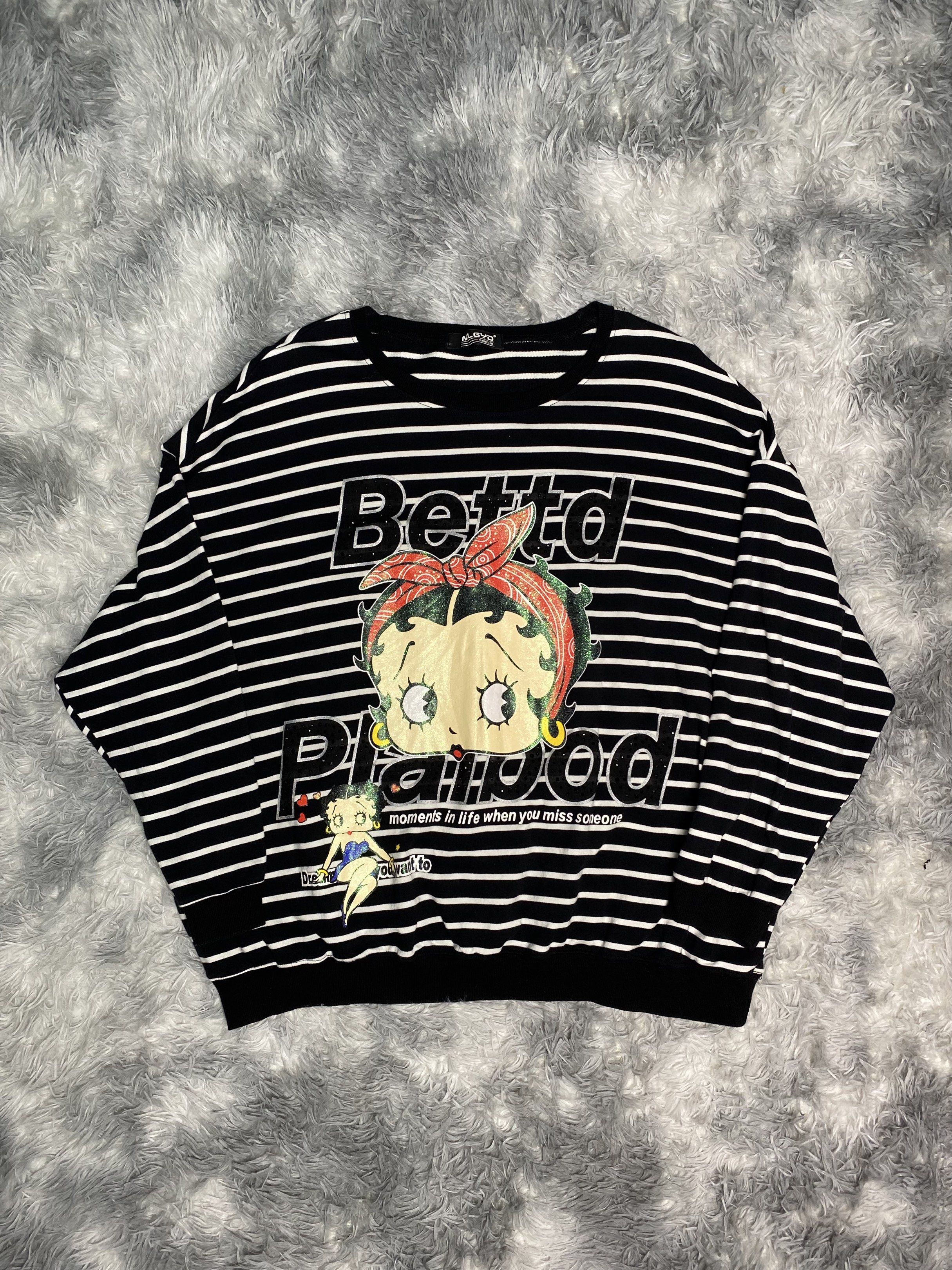 Betty Boop Striped Sweatshirt (Category: Longsleeves) located in Manila. Submitted by dignthrift (Listing ID 1417247013, Image 2). Description: - MLGYD Fashion sweatshirt - Black and white stripes - Betty Boop graphic on front - Graphic reads "Betto Plapoo" and "moments in life when you miss someone" - Crew neck - Long sleeves - Measurements in photos.