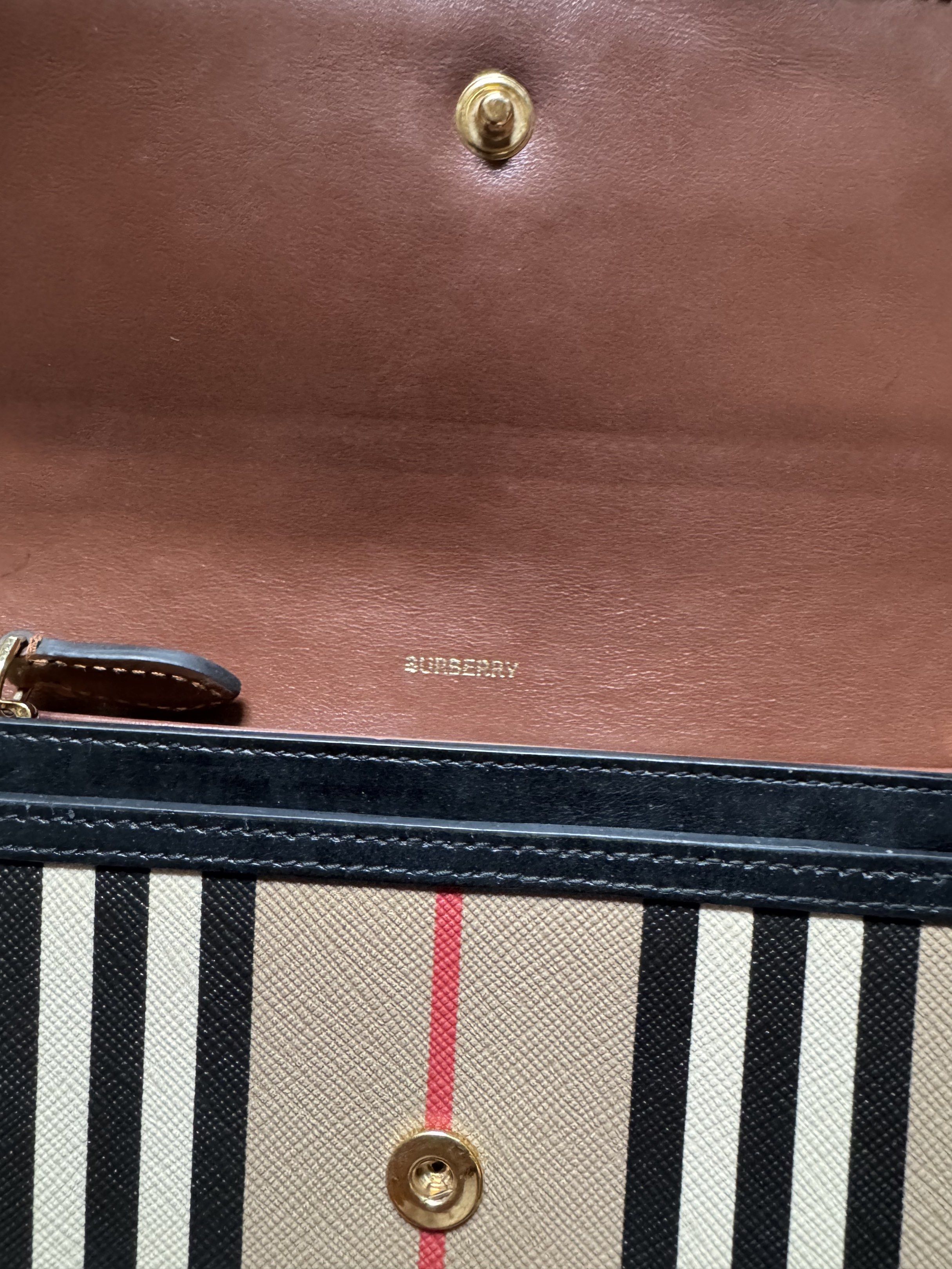 Burberry Check Long Wallet (Category: Luxury Bags & Wallets) located in Quezon City. Submitted by poyin88_ (Listing ID 1417257317, Image 3). Description: - Authentic Burberry wallet - Classic check pattern - Secure snap closure - Convenient zippered compartment - Luxurious brown leather interior - Multiple card slots - Includes Burberry logo - Comes with card.