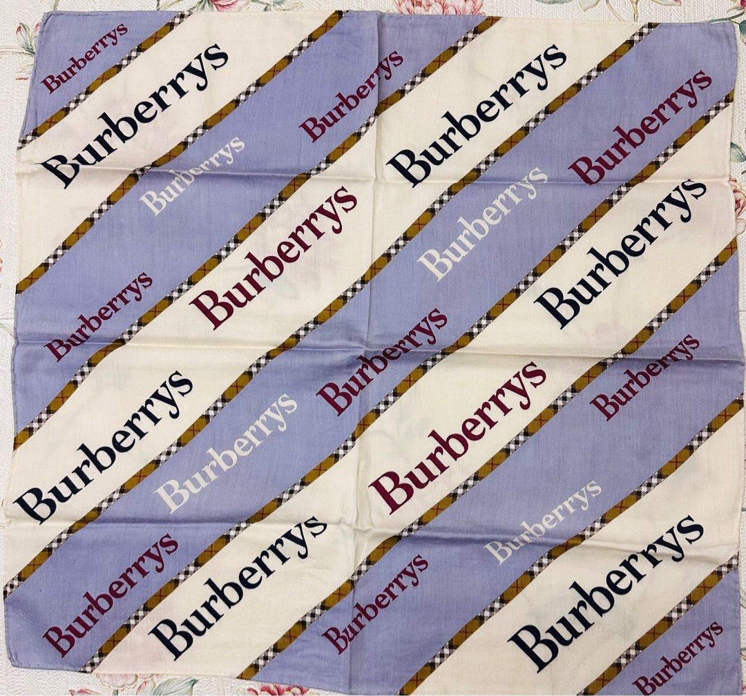BURBERRY Classic Handkerchief (Category: Luxury Accessories) located in Manila. Submitted by rarefindsgallery (Listing ID 1417296477, Image 2). Description: Burberry Classic Handkerchief Size: 19.5”” x 19” Material: 💯 cotton Hand rolled hem Authentic Made in Japan 🇯🇵 This is a vintage Burberrys handkerchief/bandana featuring the iconic check pattern with repeated BURBERRYS text..