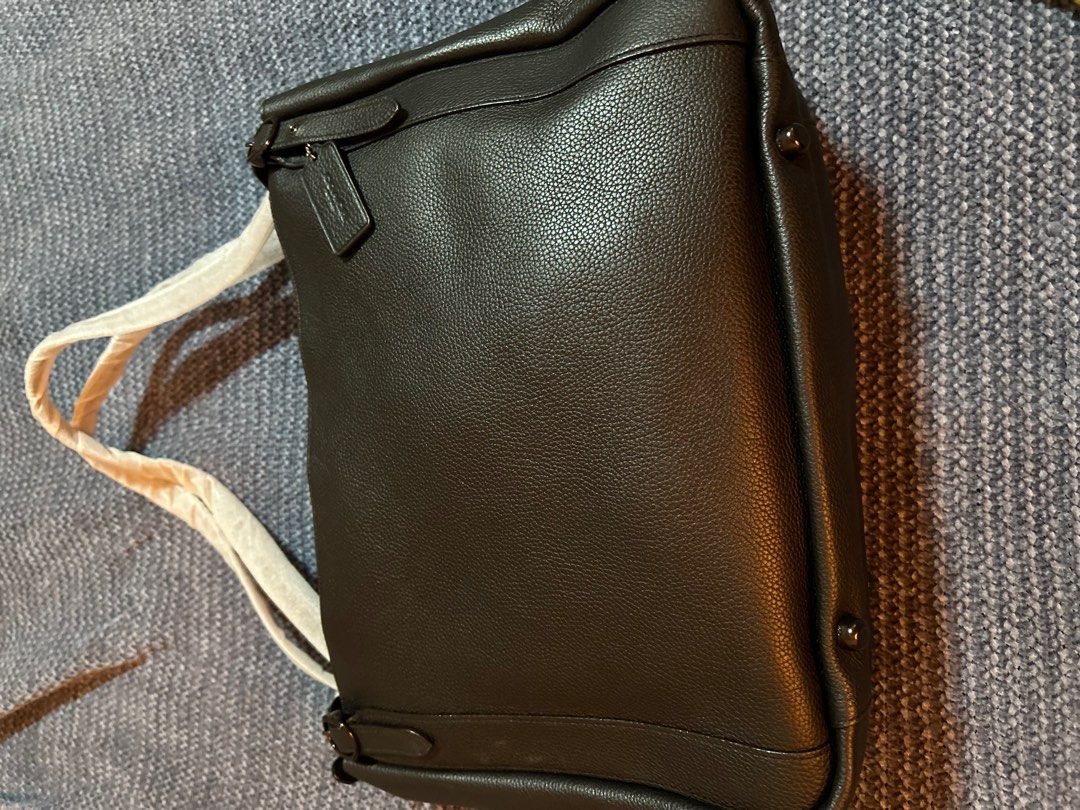 Coach Black Leather Tote Bag (Category: Tote Bags) located in Pasig City. Submitted by mixpicks (Listing ID 1417245247, Image 2). Description: - Brand new black leather Coach tote bag - Secure zip closure - Includes Coach tag - Interior pocket for organization - Comfortable double handles - Dimensions: Approximately 14 inches wide x 10 inches tall - Lined interior.