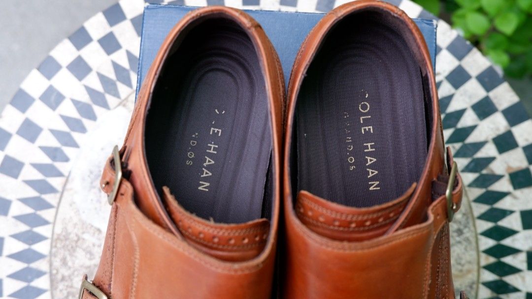 Cole Haan Harrison Grand Loafers (Category: Dress Shoes) located in Cebu City. Submitted by ohkmllr (Listing ID 1417360845, Image 3). Description: - Cole Haan Harrison Grand Double Monk shoes - Color: British Tan - Size: 8.5M - Closure: Double monk strap - Condition: Shows wear on soles - Includes original box - Features Cole Haan logo on insole.
