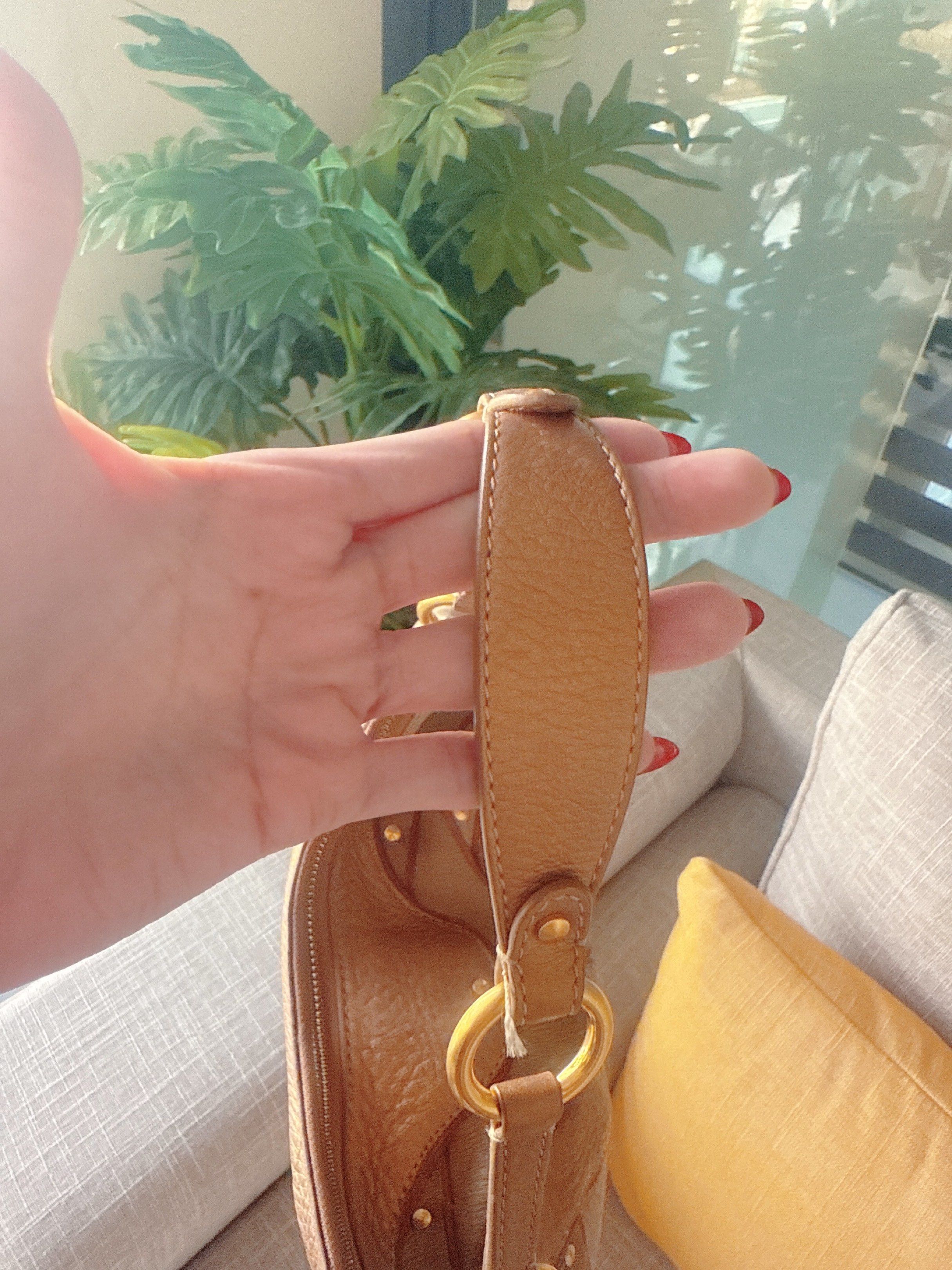 Cole Haan Shoulder Bag (Category: Luxury Bags & Wallets) located in Lucena. Submitted by fashioncult.ph (Listing ID 1417282510, Image 2). Description: - Cole Haan shoulder bag - Unique design with mixed textures and colors - Secure zip closure - Comfortable shoulder strap - Elegant gold-tone hardware - Contrasting interior lining - Includes a decorative tassel.