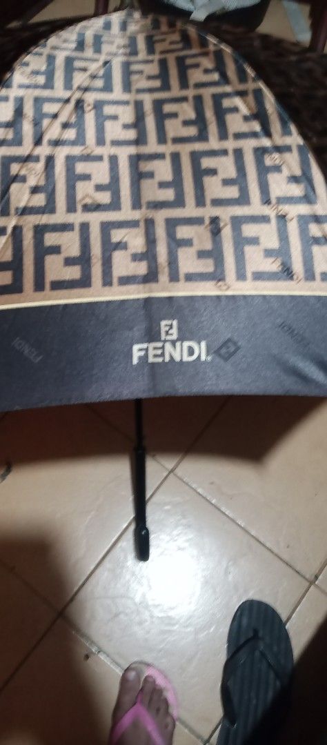 Fendi Umbrella (Category: Umbrellas) located in Makati City. Submitted by cd910625 (Listing ID 1417268473, Image 2). Description: - Authentic Fendi umbrella - Features iconic FF logo - Black handle and trim - Foldable design - Fendi logo visible - Includes matching strap.