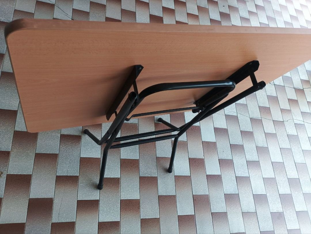 Foldable Table (Category: Tables & Sets) located in Singapore. Submitted by hippidino (Listing ID 1417331689, Image 1). Description: Foldable table Light brown surface Black metal legs see vid: https://youtube.com/shorts/5QJvv5vlJxk?feature=share delivery +$5 start by texting your address. contactless delivery to your place shoe rack / cabinet / riser please send a picture of where to place the item..