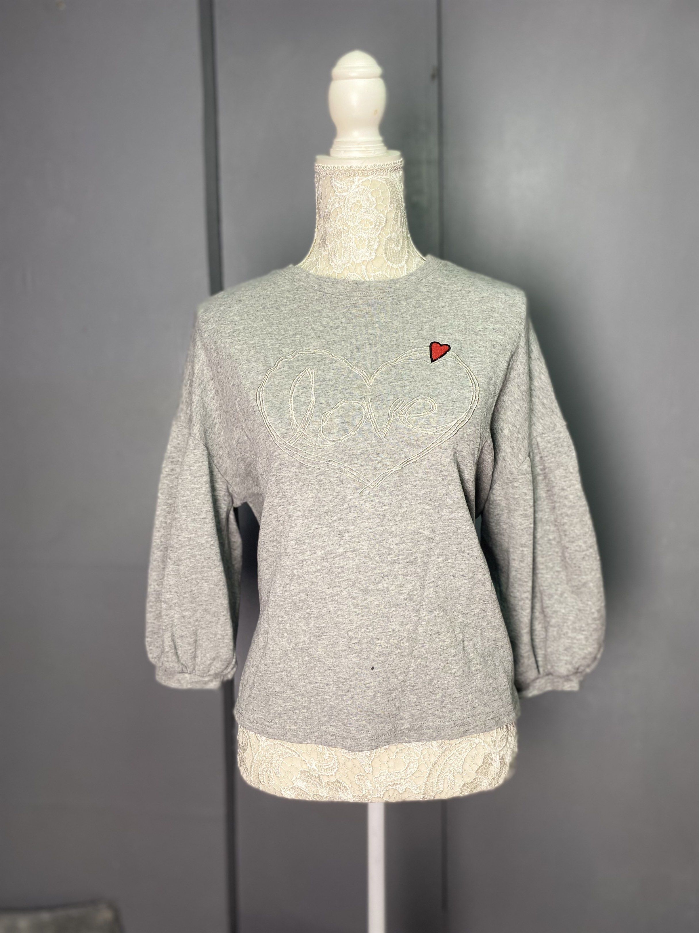 Grey Sweatshirt with Heart Detail (Category: Longsleeves) located in Manila. Submitted by dignthrift (Listing ID 1417246616, Image 1). Description: Brand: NONE Gray Women’s Crop Top SKU: 0090 Issue: None Condition: Excellent Coloration: 9/10 Size on Tag: None Width x Length: (see photos) + Shipping Fee 📌 Location: Las Piñas City, Metro Manila 📌 MOP: G CASH 📌 No Refund, No Return Ask for Details 📌 J&T Courier & LBC 📌 Due to lighting when the 