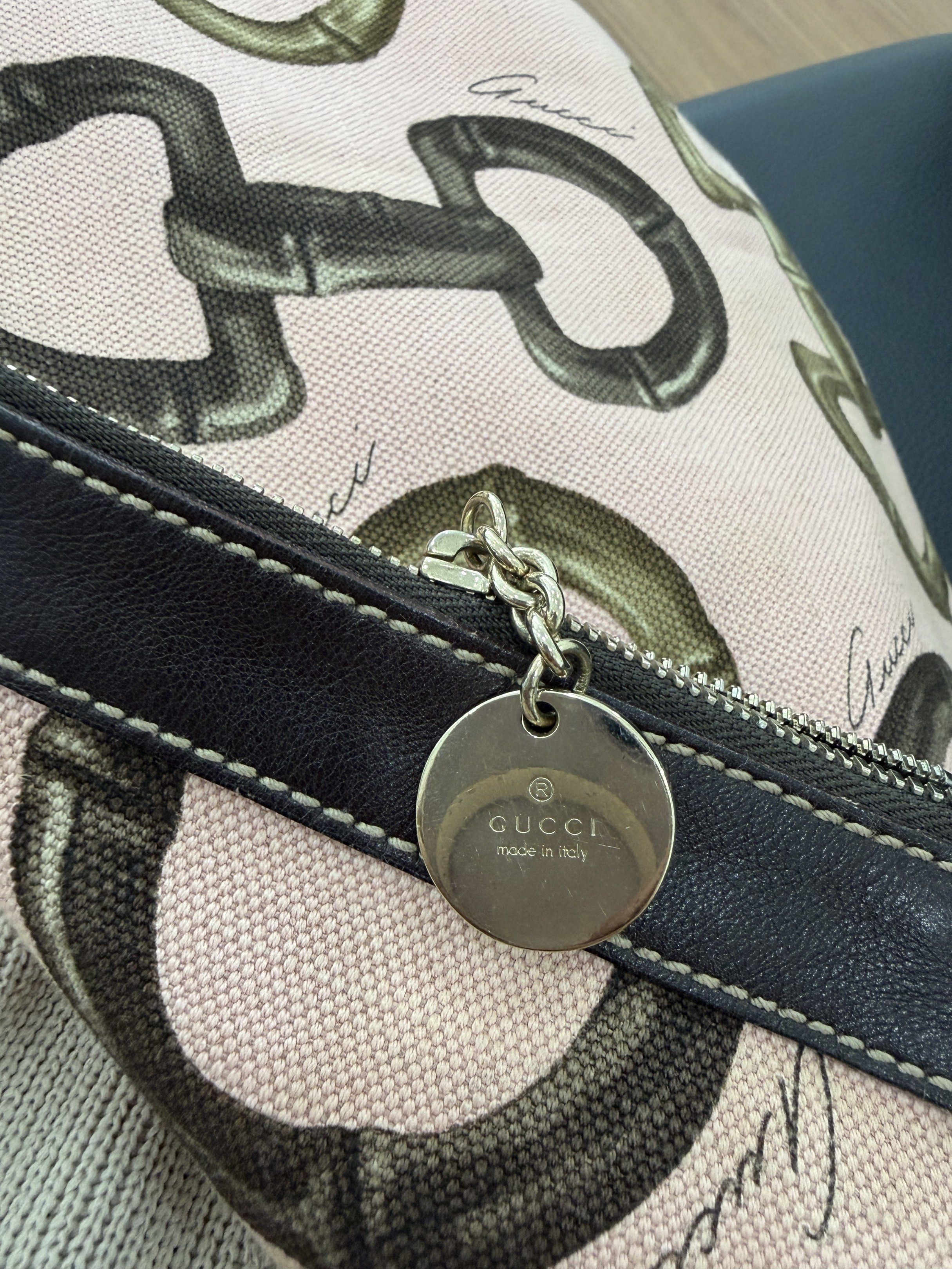 Gucci Pink Canvas Hobo Shoulder Bag (Category: Luxury Bags & Wallets) located in Vigan. Submitted by longliveolive (Listing ID 1417238747, Image 3). Description: - Gucci shoulder bag - Pink canvas exterior with equestrian bit pattern - Brown leather shoulder strap and trim - Zipper closure - Brown fabric interior lining - Serial number: 154401 205011.