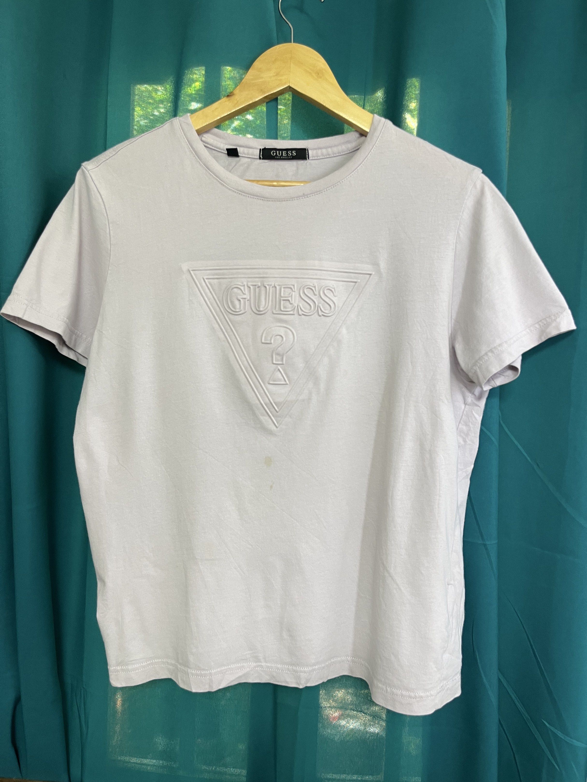 Guess Embossed Logo T-shirt - Medium (Category: Tshirts & Polo Shirts ) located in General Santos City (Dadiangas). Submitted by crisjayg (Listing ID 1417365974, Image 1). Description: - Authentic Guess t-shirt - Light purple color - Size: M - Embossed Guess logo on front - Material: 100% cotton - Made in China - Measurements: - Length: 25 inches - Chest: 19 inches.
