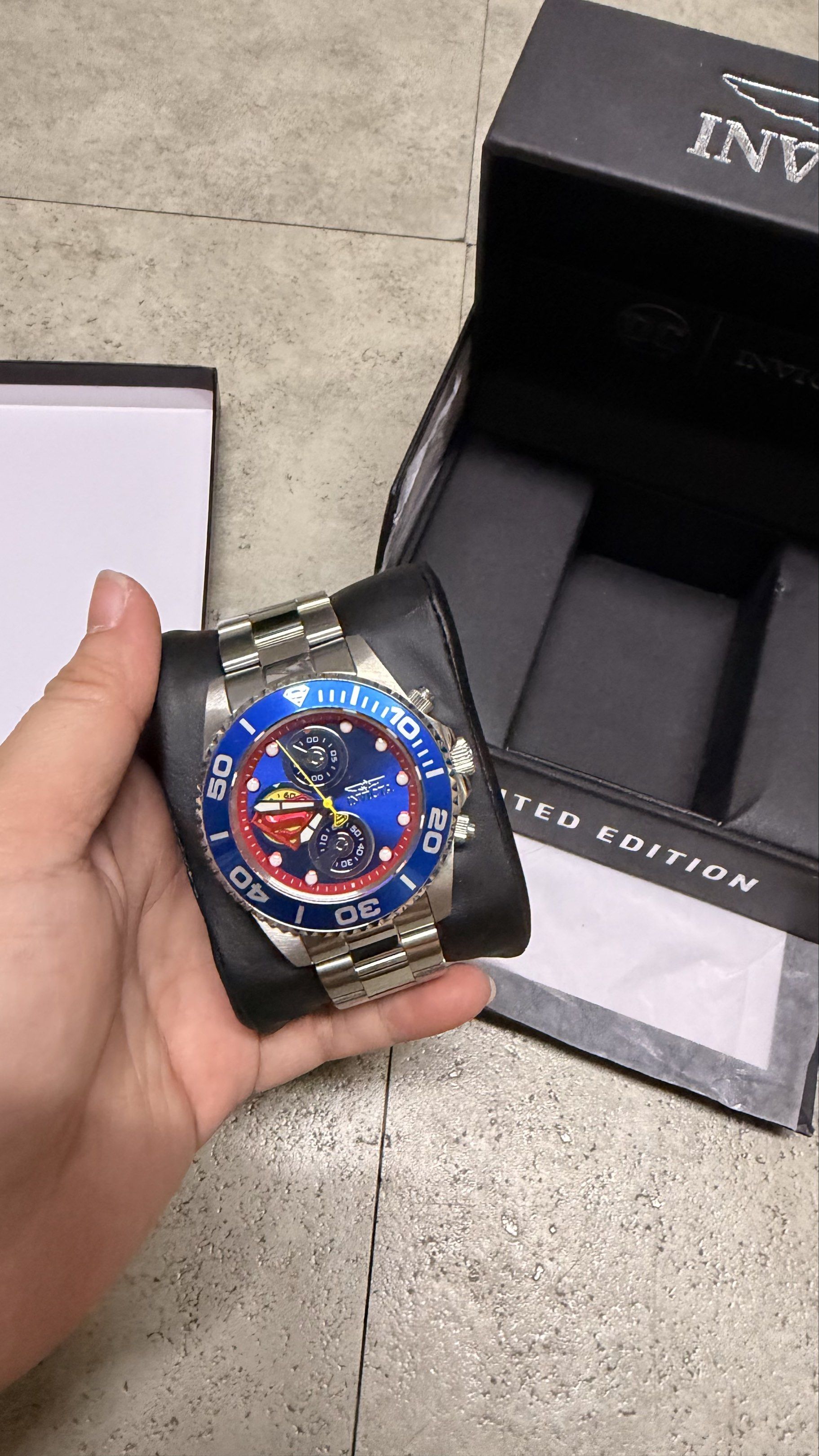 Invicta DC Comics Limited Edition Watch (Category: Men's Watches) located in Cavite. Submitted by rhea0218 (Listing ID 1417248449, Image 1). Description: - Invicta DC Comics Limited Edition Watch - Striking blue dial and bezel - Durable stainless steel band - Functional chronograph feature - Includes original box with DC Comics design and Invicta logo - Presented on a black cushion.