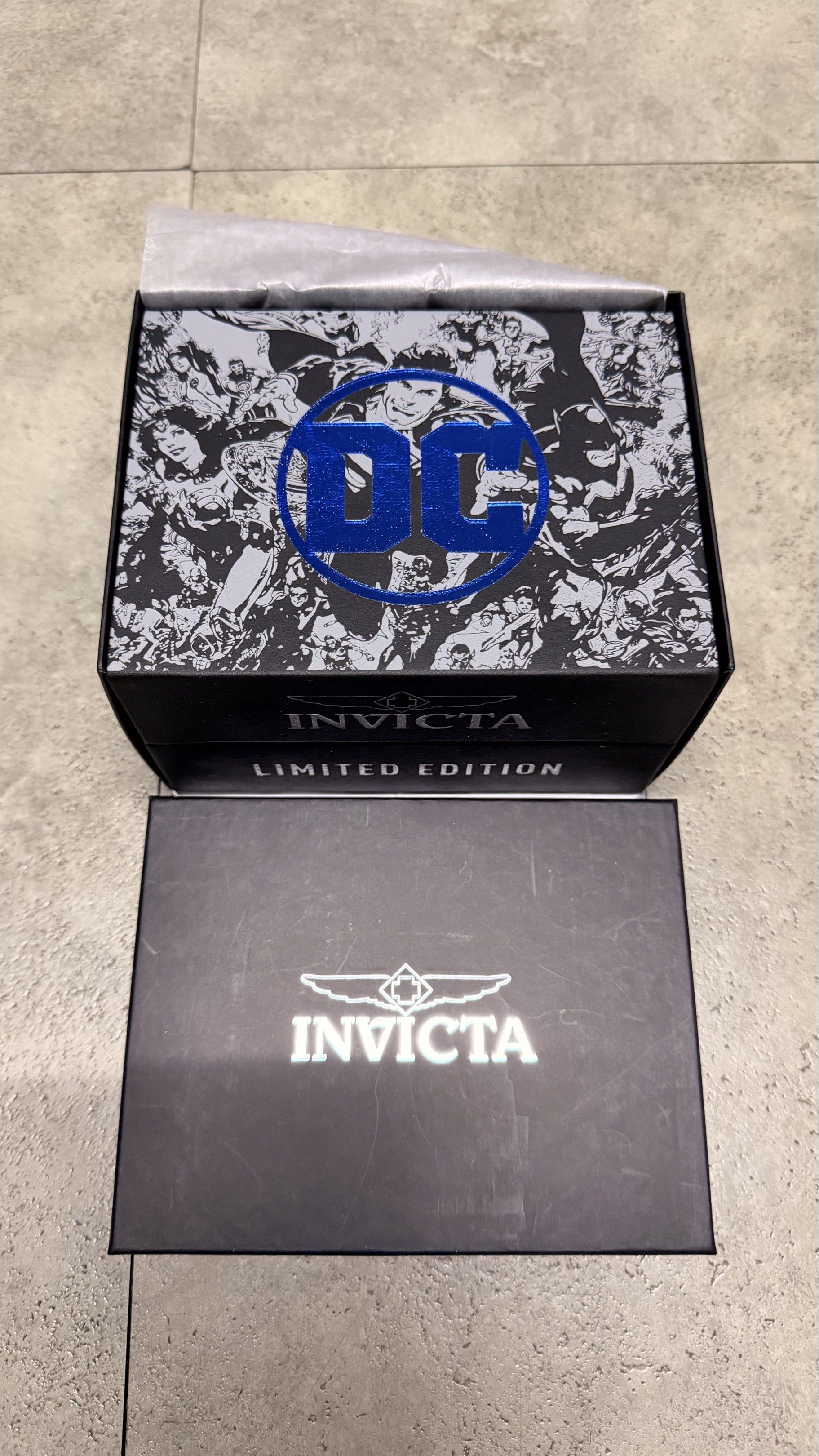 Invicta DC Comics Limited Edition Watch (Category: Men's Watches) located in Cavite. Submitted by rhea0218 (Listing ID 1417248449, Image 2). Description: - Invicta DC Comics Limited Edition Watch - Striking blue dial and bezel - Durable stainless steel band - Functional chronograph feature - Includes original box with DC Comics design and Invicta logo - Presented on a black cushion.