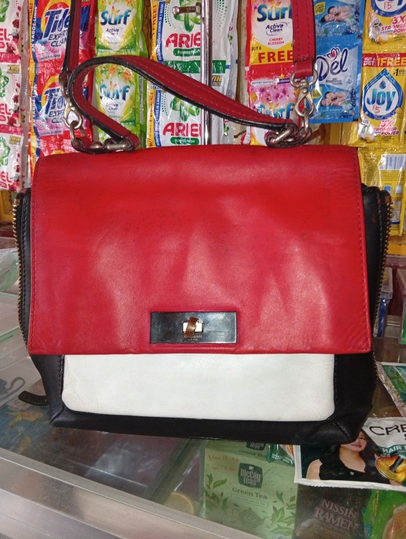 Kate Spade Small Abbie Beverly Road Handbag (Category: Luxury Bags & Wallets) located in Manila. Submitted by hermosa_la_tienda (Listing ID 1417282470, Image 2). Description: - Kate Spade handbag - Color: Red, white, and black - Features a top handle and detachable shoulder strap - Rectangular shape - Flap closure - Red interior with zipper closure - Metal lock with Kate Spade logo - Zipper on the side - Ykk zipper - Guarantee Authentic issues: m