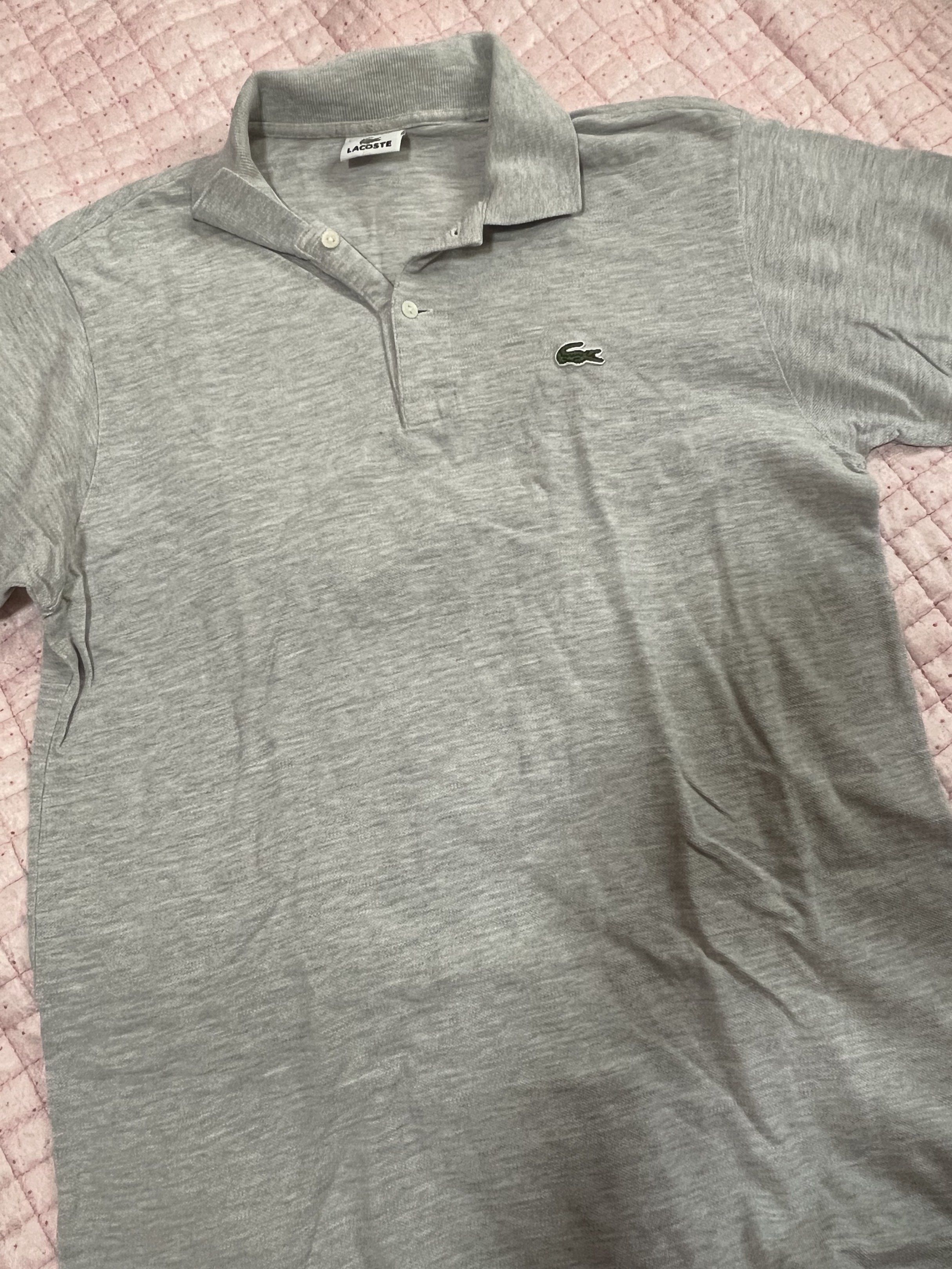 Lacoste Grey Polo Shirt (Category: Tshirts & Polo Shirts ) located in Bulacan. Submitted by nickxee (Listing ID 1417234777, Image 2). Description: - Authentic Lacoste polo shirt - Color: Grey - Features the iconic crocodile logo - Collared neckline - Short sleeves - Button-up placket - Comfortable fabric - Perfect for casual wear Size 5 .