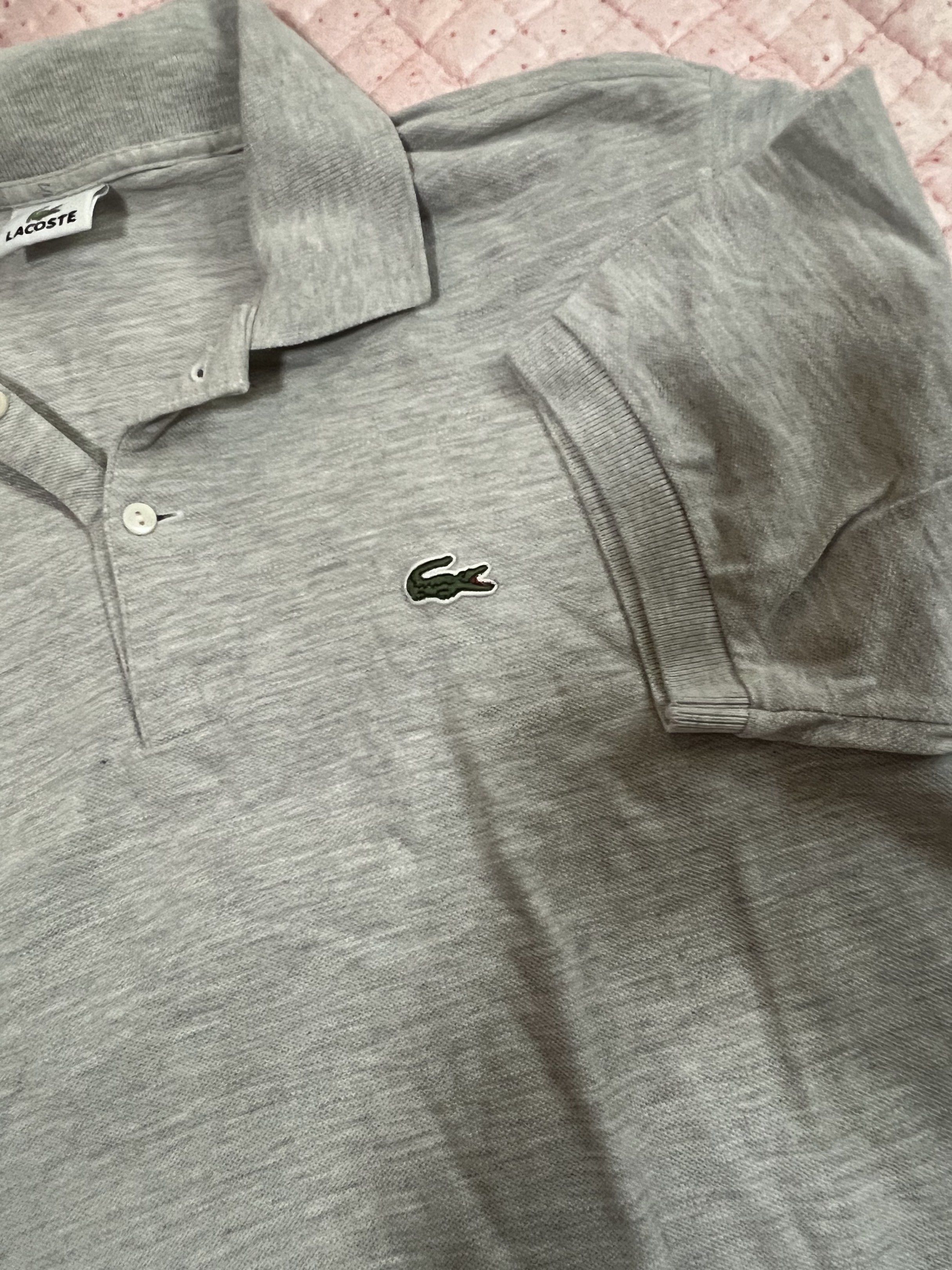 Lacoste Grey Polo Shirt (Category: Tshirts & Polo Shirts ) located in Bulacan. Submitted by nickxee (Listing ID 1417234777, Image 1). Description: - Authentic Lacoste polo shirt - Color: Grey - Features the iconic crocodile logo - Collared neckline - Short sleeves - Button-up placket - Comfortable fabric - Perfect for casual wear Size 5 .