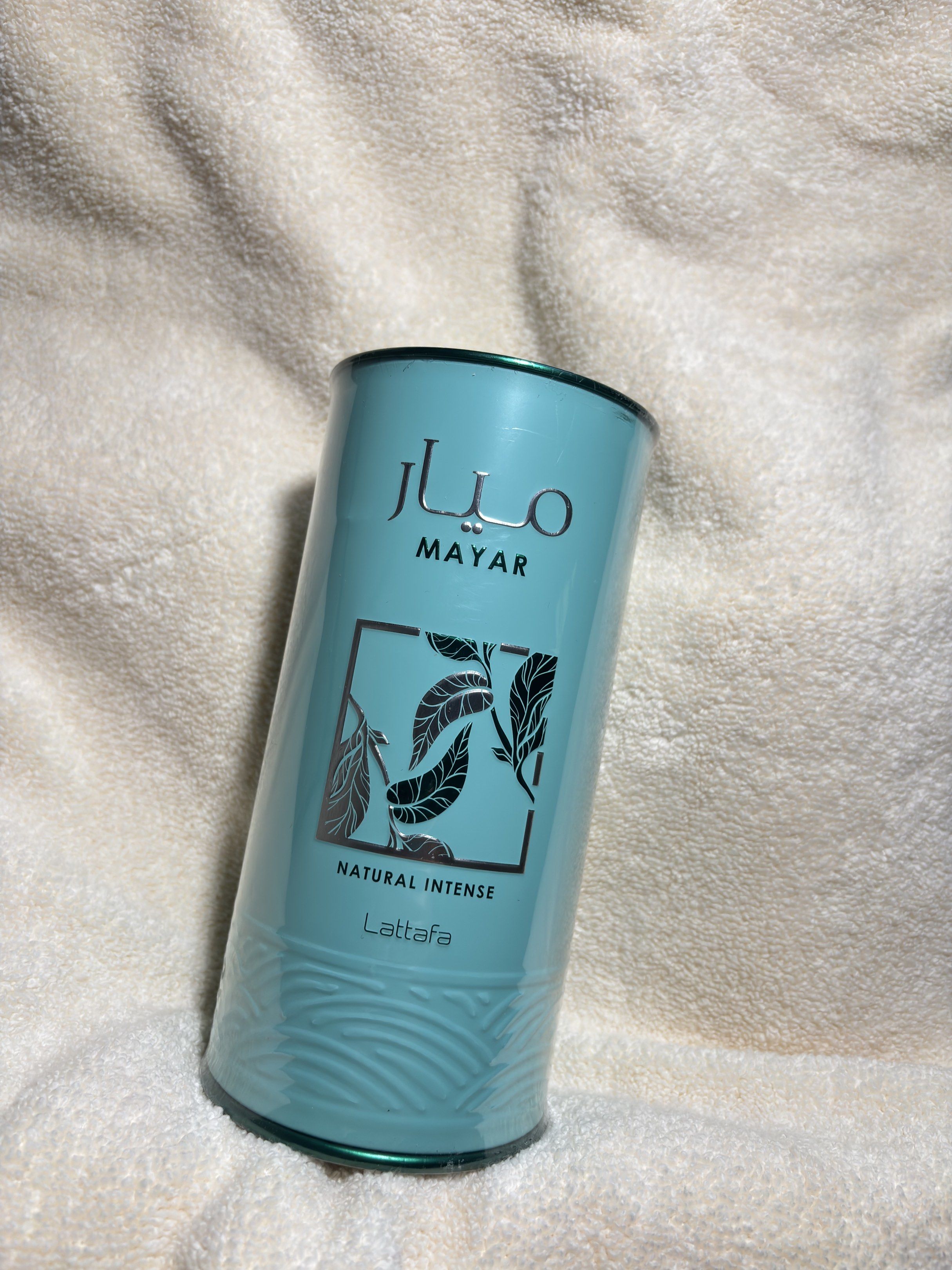 Lattafa Mayar Natural Intense Perfume (Category: Fragrance & Deodorants) located in Quezon City. Submitted by ysiocoxx (Listing ID 1417368538, Image 1). Description: - Lattafa Mayar Natural Intense perfume - Light teal packaging with silver accents - Cylindrical bottle - Comes in original packaging - Features a QR code - Includes brand's social media handles.