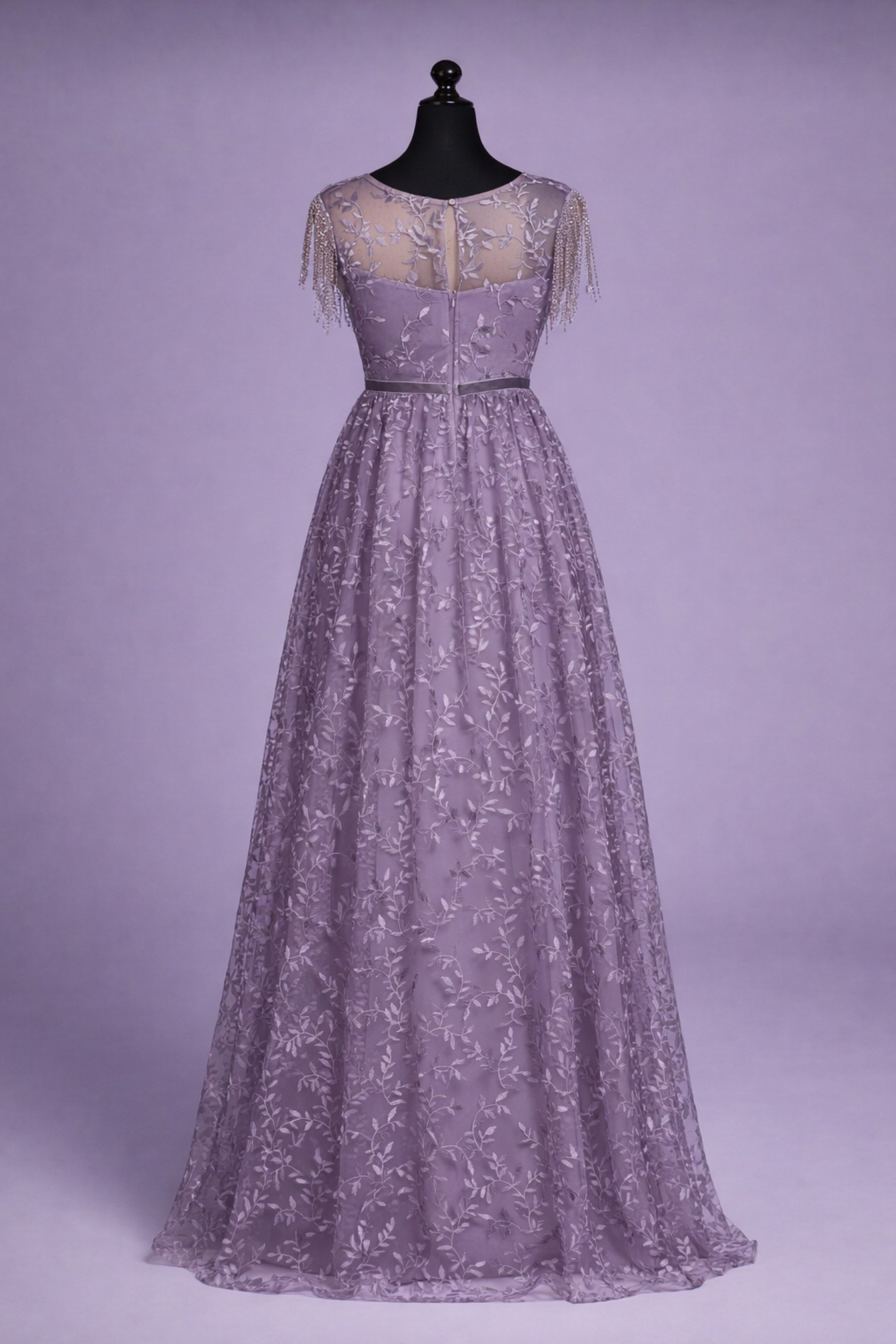 Lavender Embellished Evening Gown (Category: Evening dresses & gowns) located in Taguig. Submitted by wountersdam (Listing ID 1417318824, Image 2). Description: Elegant lavender evening gown with intricate leaf embroidery. Features a round neckline with beaded fringe detailing on the shoulders. Includes a matching velvet belt that cinches the waist. The dress has a flowing, floor-length skirt. Perfect for formal events and special occasions. - Bo