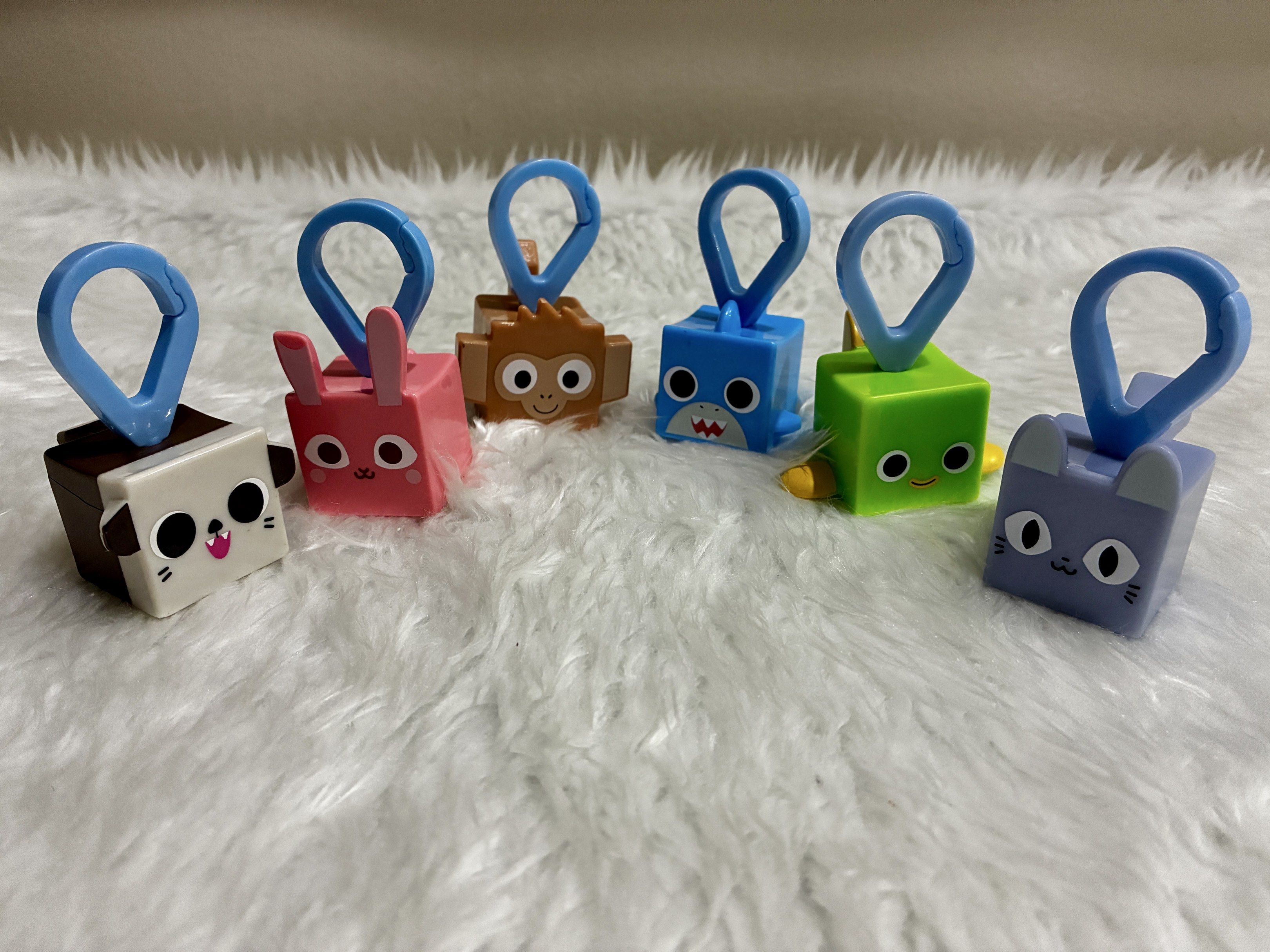 Mcdonalds Happy Meal Pet Simulator X Keychain (Category: Character Goods) located in Quezon City. Submitted by inmycloset03 (Listing ID 1417382079, Image 1). Description: - Pet Simulator X Keychains - Featuring adorable animal designs: dog, bunny, monkey, shark, green creature, and cat. - Each keychain includes a convenient blue clip. - Perfect for keys, bags, and backpacks! - Add a touch of fun to your everyday items. - P40 each or take all for 