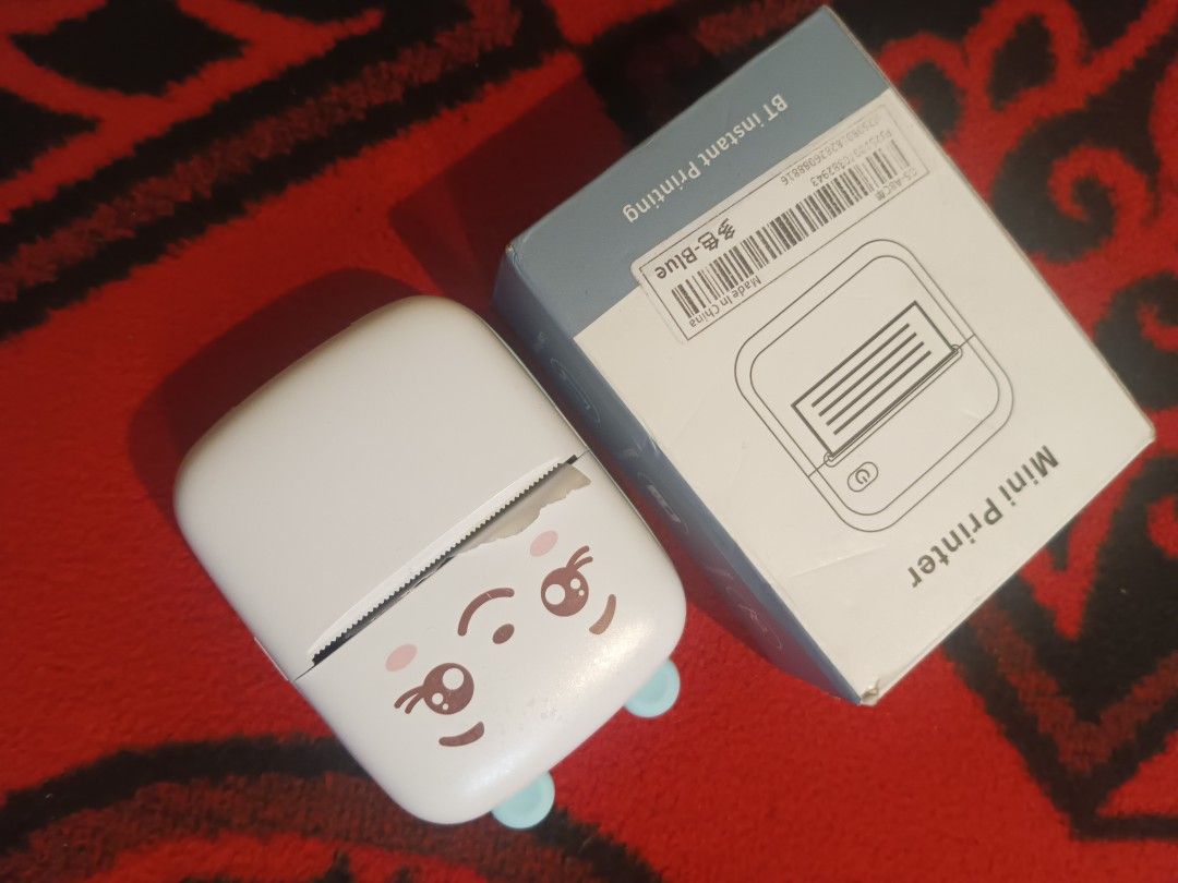 Mini Bluetooth thermal printer (Category: Other Gadgets) located in Quezon City. Submitted by markgolveo (Listing ID 1417219648, Image 2). Description: Mini Bluetooth thermal printer with power tested okay detected connecting via phone good battery life tested test print it works by double pressing power button paper feed roll mechanism works with issue can't seem to have my images or texts on phone printed shows notification print failing.