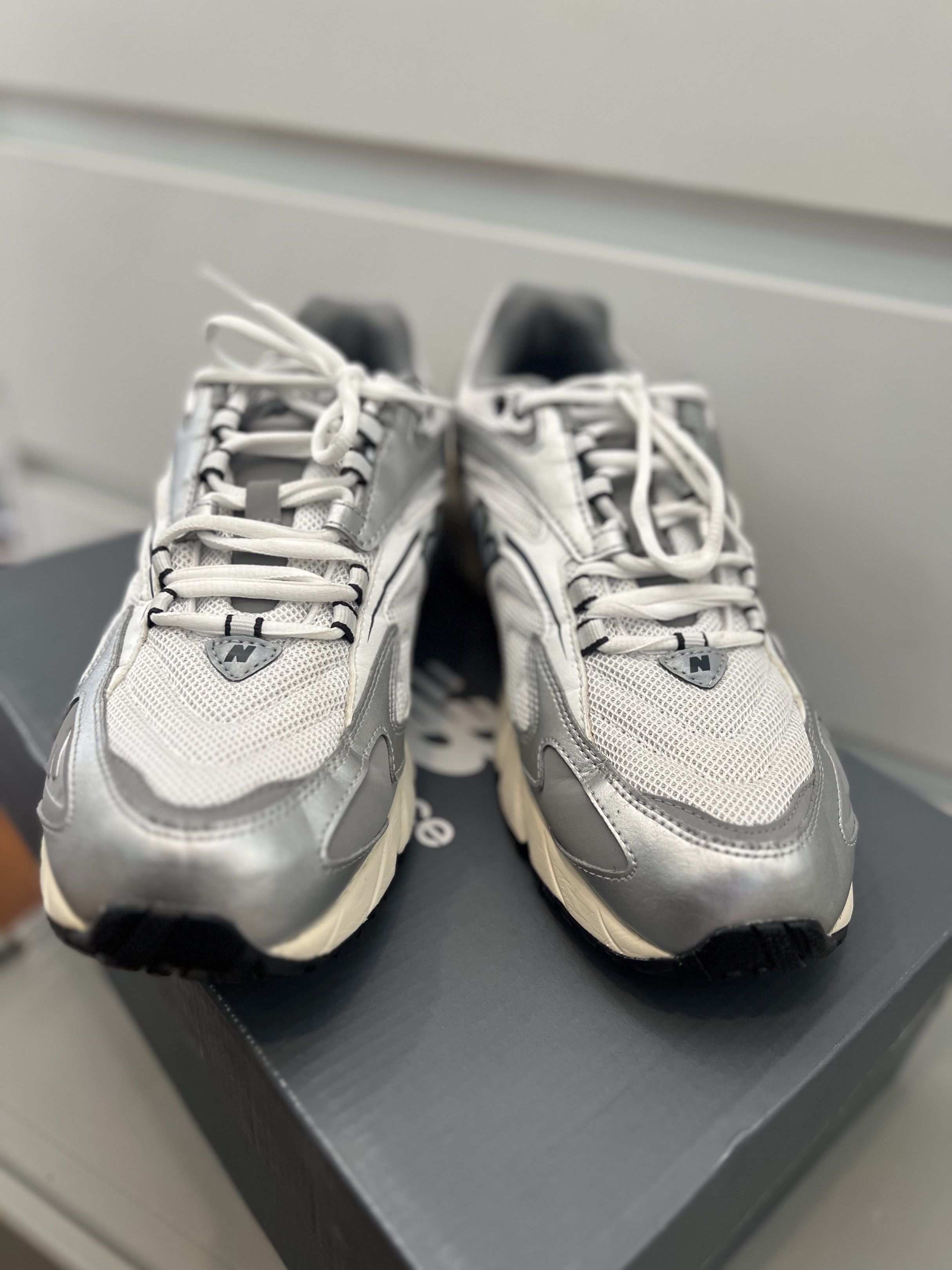 New Balance 725 Silver Sneakers (Category: Sneakers) located in Quezon City. Submitted by authenticcloset (Listing ID 1417321854, Image 2). Description: - New Balance 725 sneakers - Color: Silver and White - Size: US 11, UK 10.5, EUR 45 - Features: Mesh upper, cushioned midsole, durable rubber outsole - Includes original box Used only during pictorial.
