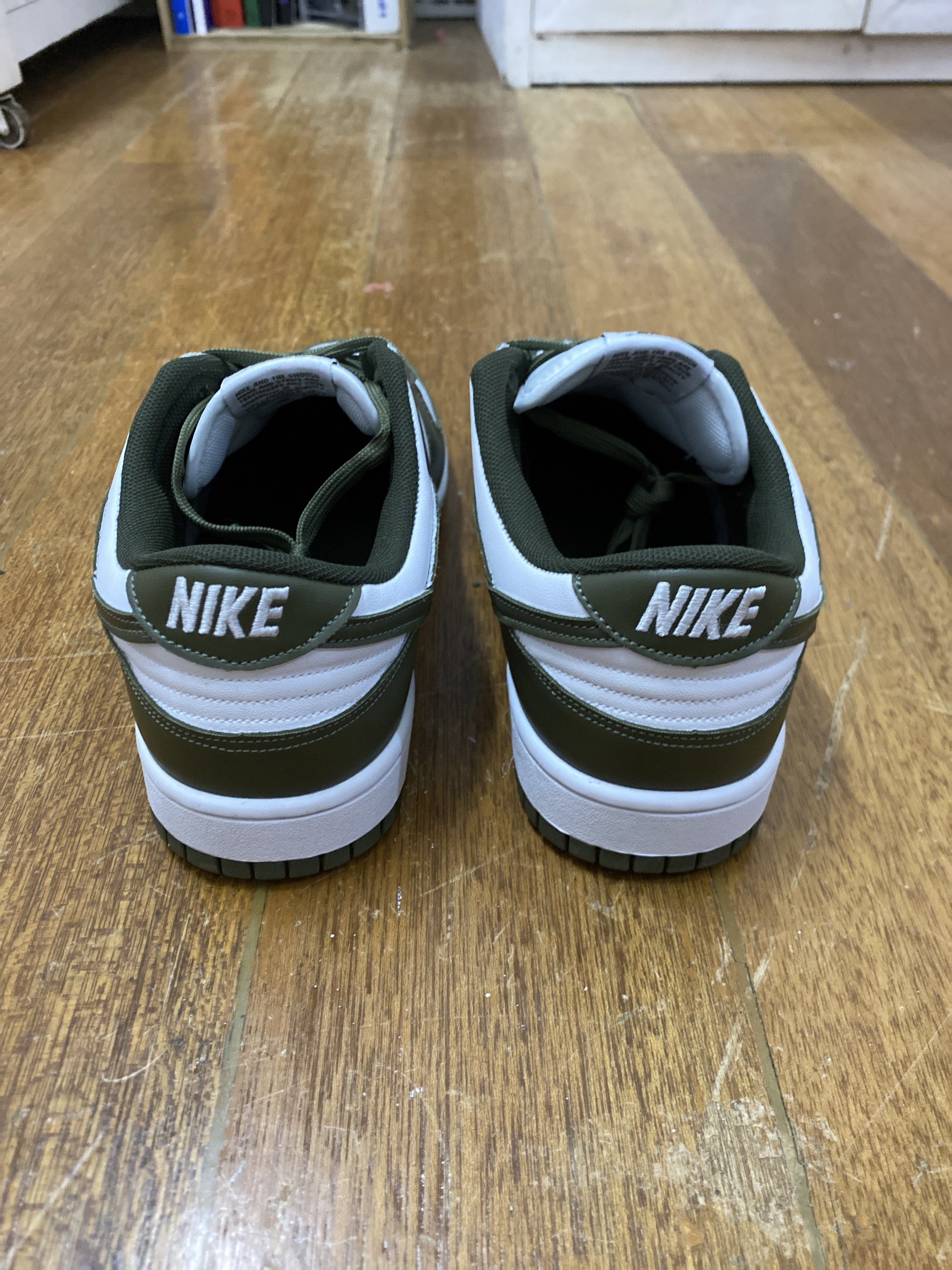 Nike Dunk Low Olive Green (Category: Sneakers) located in Manila. Submitted by royallion-4c29 (Listing ID 1417383680, Image 2). Description: UA (same material as og) - Nike Dunk Low - Olive green and white colorway - Nike logo on side, tongue, and heel - White midsole, olive green outsole - Olive green laces.