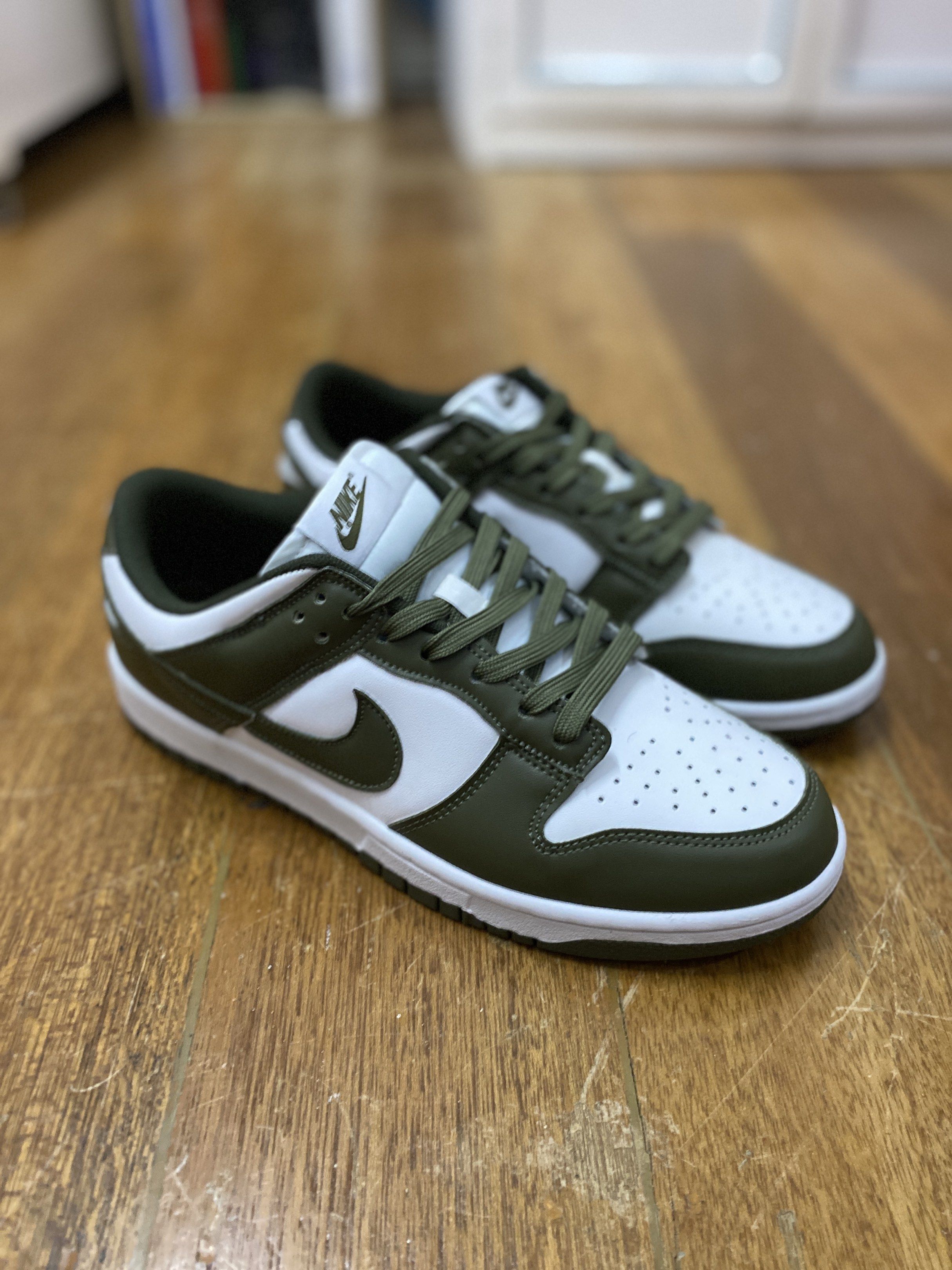 Nike Dunk Low Olive Green (Category: Sneakers) located in Manila. Submitted by royallion-4c29 (Listing ID 1417383680, Image 1). Description: UA (same material as og) - Nike Dunk Low - Olive green and white colorway - Nike logo on side, tongue, and heel - White midsole, olive green outsole - Olive green laces.