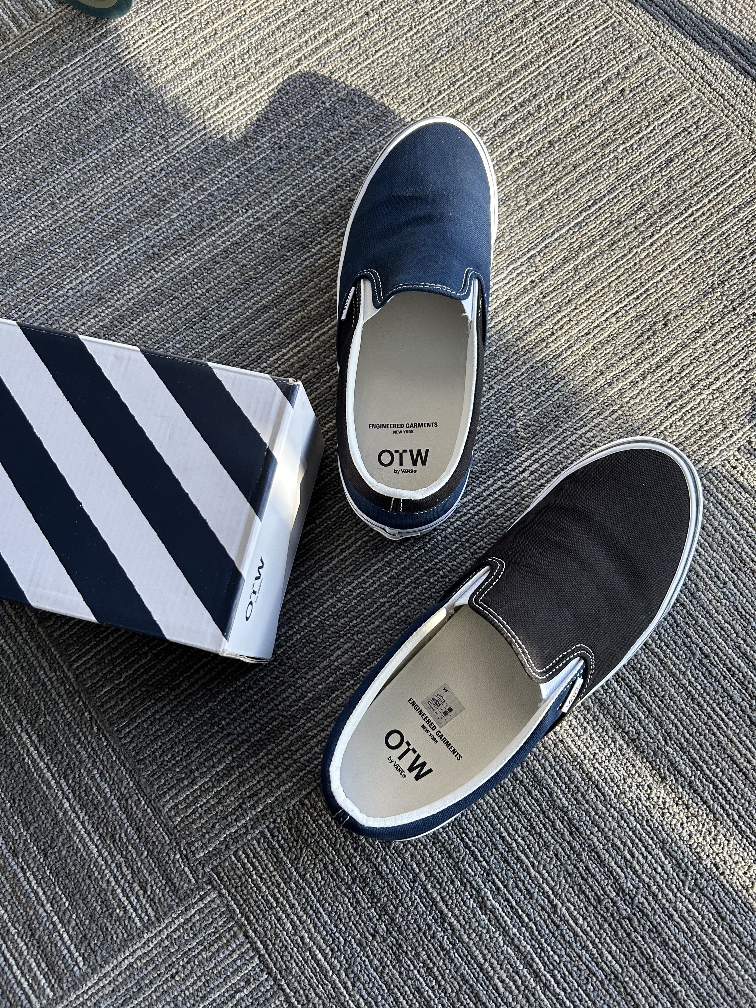 OTWbyVans x Engineered Garments (Category: Sneakers) located in Manila. Submitted by bodegabodega (Listing ID 1417388094, Image 1). Description: - Vans x Engineered Garments collaboration - Slip-on style sneakers - Color: Navy and Black - Includes original box - White midsole - Engineered Garments logo on insole - Engineered Garments logo on box WTS OTWByVans x Engineered Garments NY Used once Complete With Box and Receipt Good as new Size 11 Bou