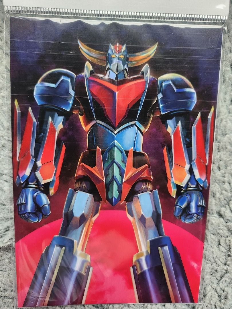 Plastic File Folder UFO Robo Grendizer (Category: Stationery & School Supplies) located in Caloocan City. Submitted by banshee8818 (Listing ID 1417393669, Image 3). Description: - Brand new Grendizer U folder. - Still sealed in its original packaging. - Front: Detailed illustration of Grendizer. - Back: Grendizer U logo against a space background..