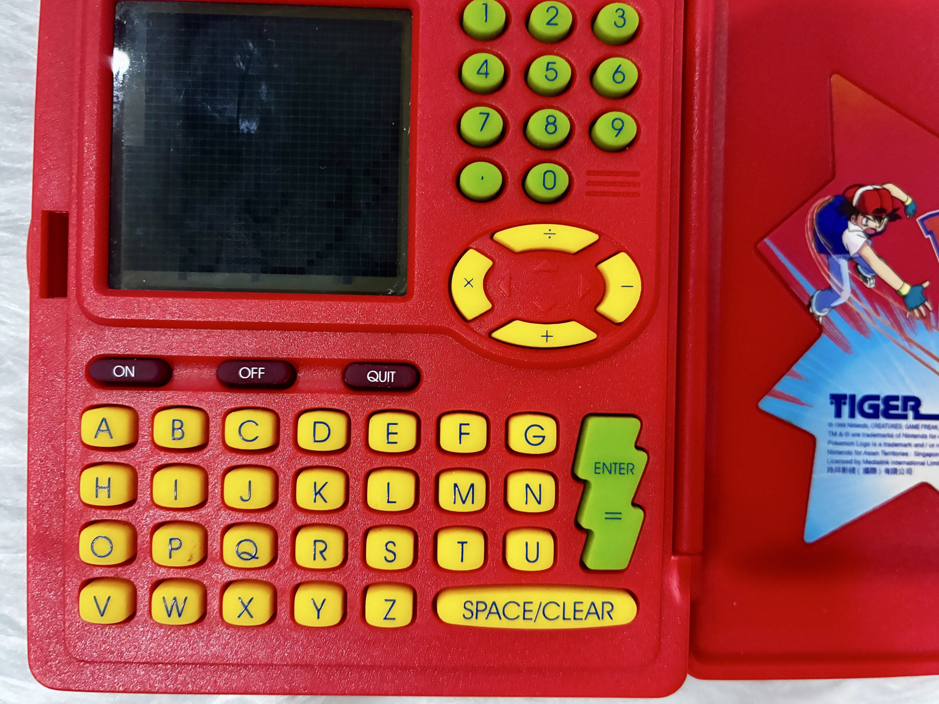 Preloved Original Pokemon Pokedex by Tiger (Category: Character Goods) located in Quezon City. Submitted by inmycloset03 (Listing ID 1417304902, Image 2). Description: - Preloved Original Pokemon Pokedex by Tiger - Classic red design - Features the iconic Pokemon logo and characters - Fully functional screen and buttons - A great addition to any Pokemon collection - Perfect for fans of all ages ** ISSUE upper left side screen dead pixel see photo