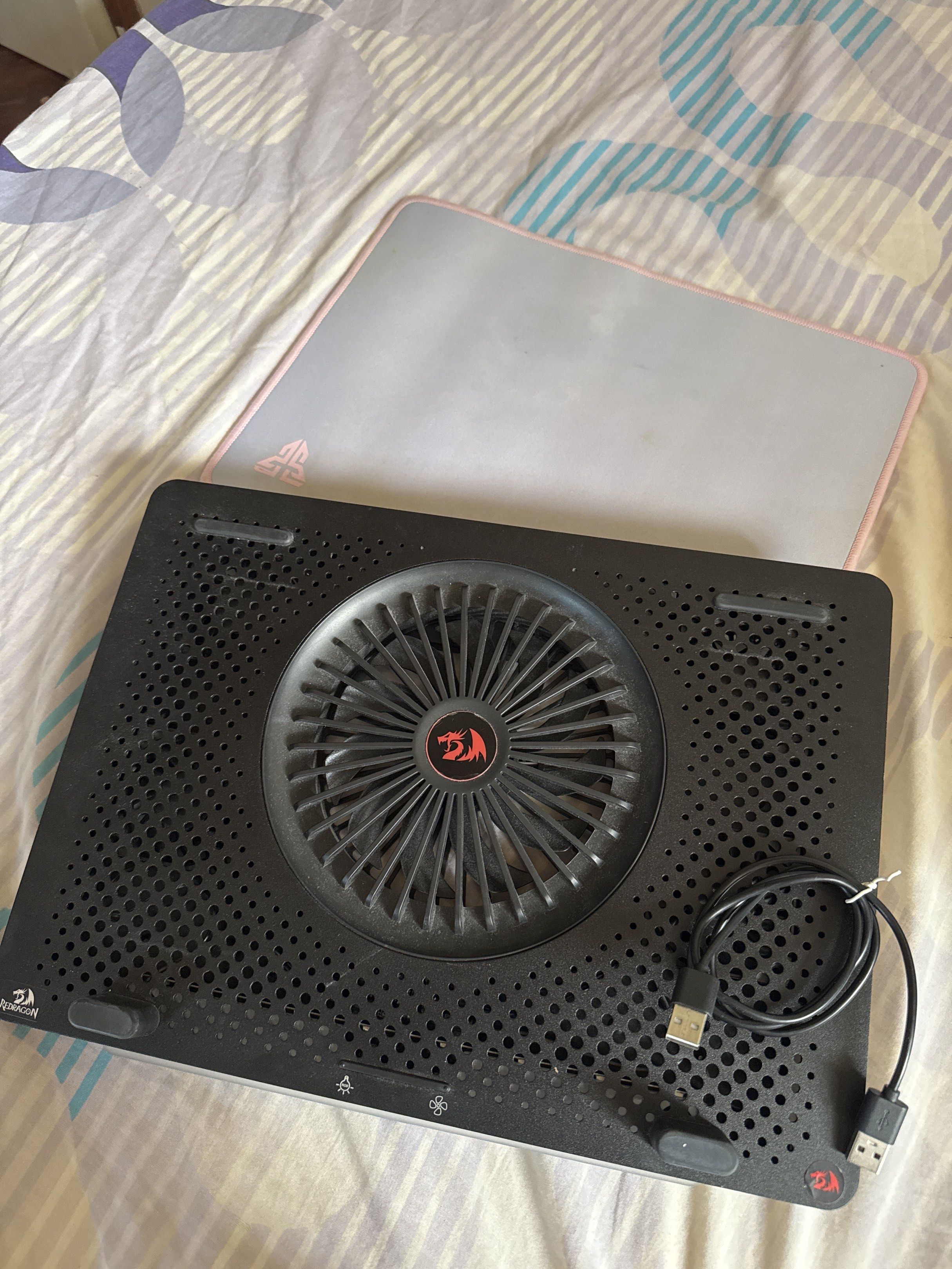 Redragon Laptop Cooler (Category: Laptops & Notebooks) located in Bacoor. Submitted by blueberrycheesecake11 (Listing ID 1417231477, Image 1). Description: Redragon laptop cooler features a large fan for efficient cooling. It has an adjustable stand for comfortable viewing angles. The cooler includes a USB cable for power + Mouse Pad for FREE!! Wala na pong Box! but I can pack it with a box and bubble wrap.