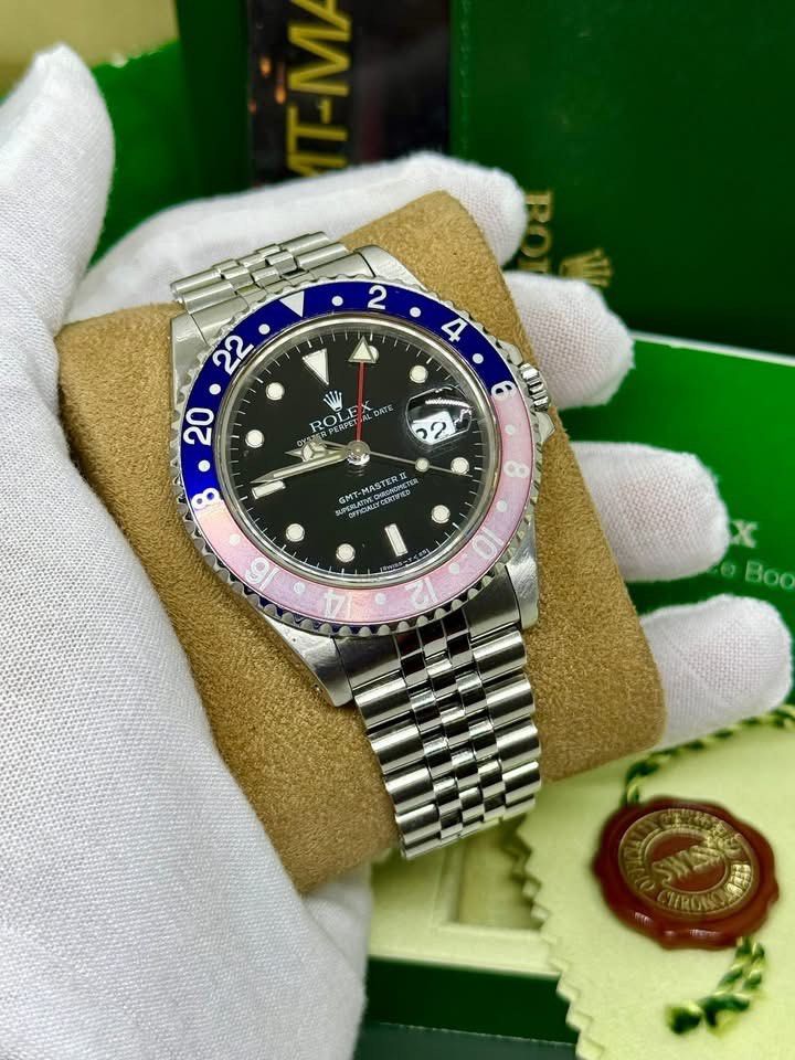 Rolex GMT-Master II Pepsi (Category: Luxury Watches) located in Cabanatuan. Submitted by albertgonzales27 (Listing ID 1417399783, Image 2). Description: - Rolex GMT-Master II - Black dial - Blue and pink bezel - Stainless steel Jubilee bracelet - Includes original box and paperwork - Date display at 3 o'clock.
