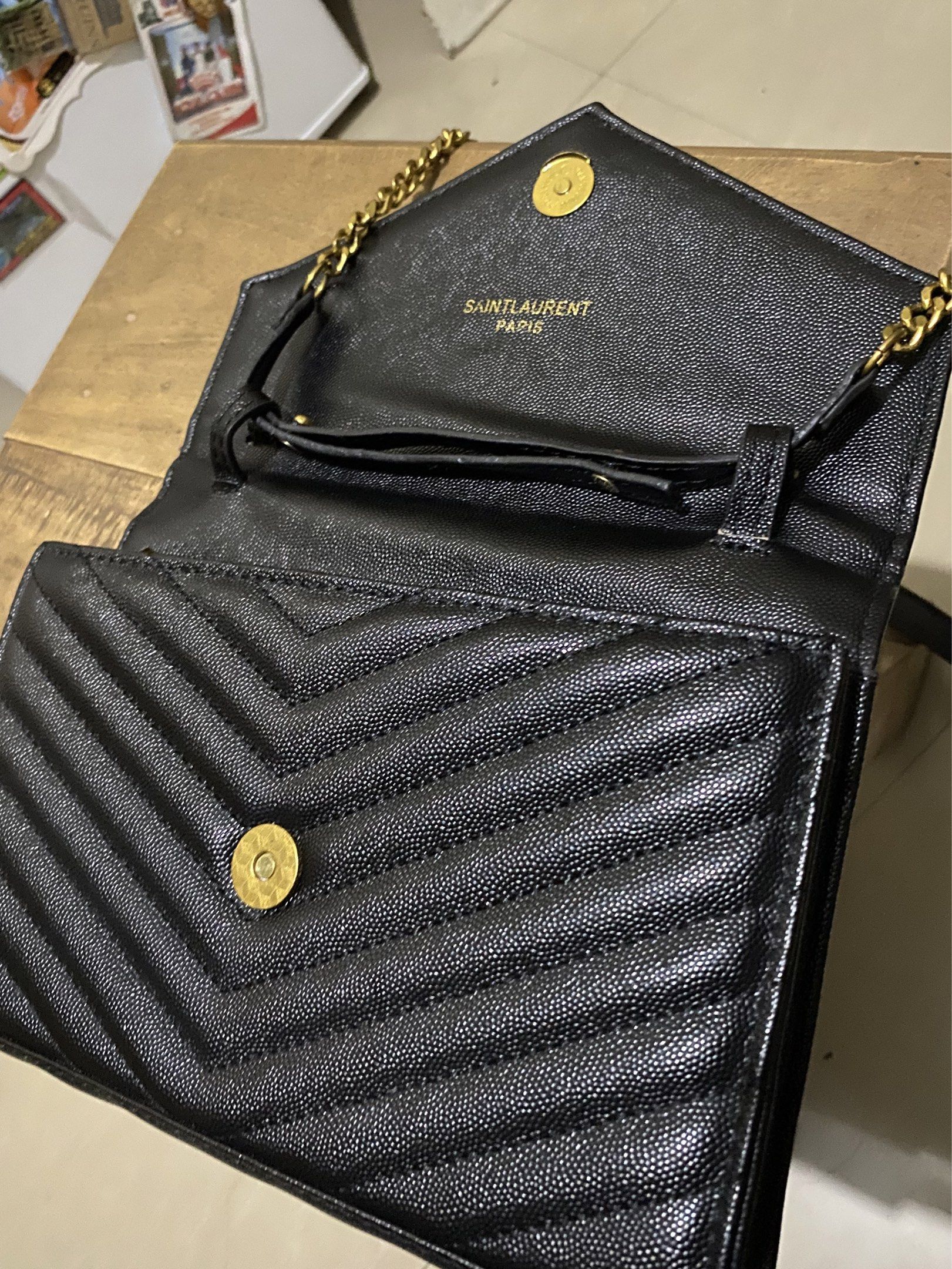 YSL Envelope Chain Wallet (Category: Luxury Bags & Wallets) located in Munoz. Submitted by harm0nica337 (Listing ID 1417321688, Image 3). Description: Thrifted, unknown authenticity 23 cm x16 cm MOP: Gcash (Price +SF) J&T express.
