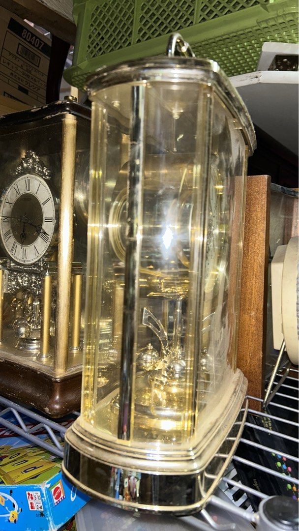 STUNNING GOLD DECOR TABLE CLOCK WITH PIVOTING ORNAMENT (Category: Clocks) located in Valenzuela. Submitted by gregferraren (Listing ID 1417331079, Image 2). Description: Imported Seiko Uses 2 AA batteries Made of Bento material. note: dusty from shipping. Sure buyer may inquire video/ charged real time delivery or shipping nationwide upon confirming order thru preferred metrobank/ bdo/ gotyme bank/ maya bank payment channels..