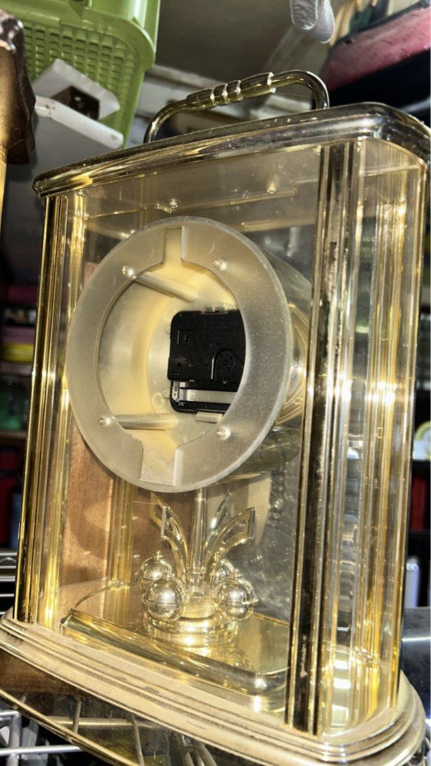 STUNNING GOLD DECOR TABLE CLOCK WITH PIVOTING ORNAMENT (Category: Clocks) located in Valenzuela. Submitted by gregferraren (Listing ID 1417331079, Image 3). Description: Imported Seiko Uses 2 AA batteries Made of Bento material. note: dusty from shipping. Sure buyer may inquire video/ charged real time delivery or shipping nationwide upon confirming order thru preferred metrobank/ bdo/ gotyme bank/ maya bank payment channels..