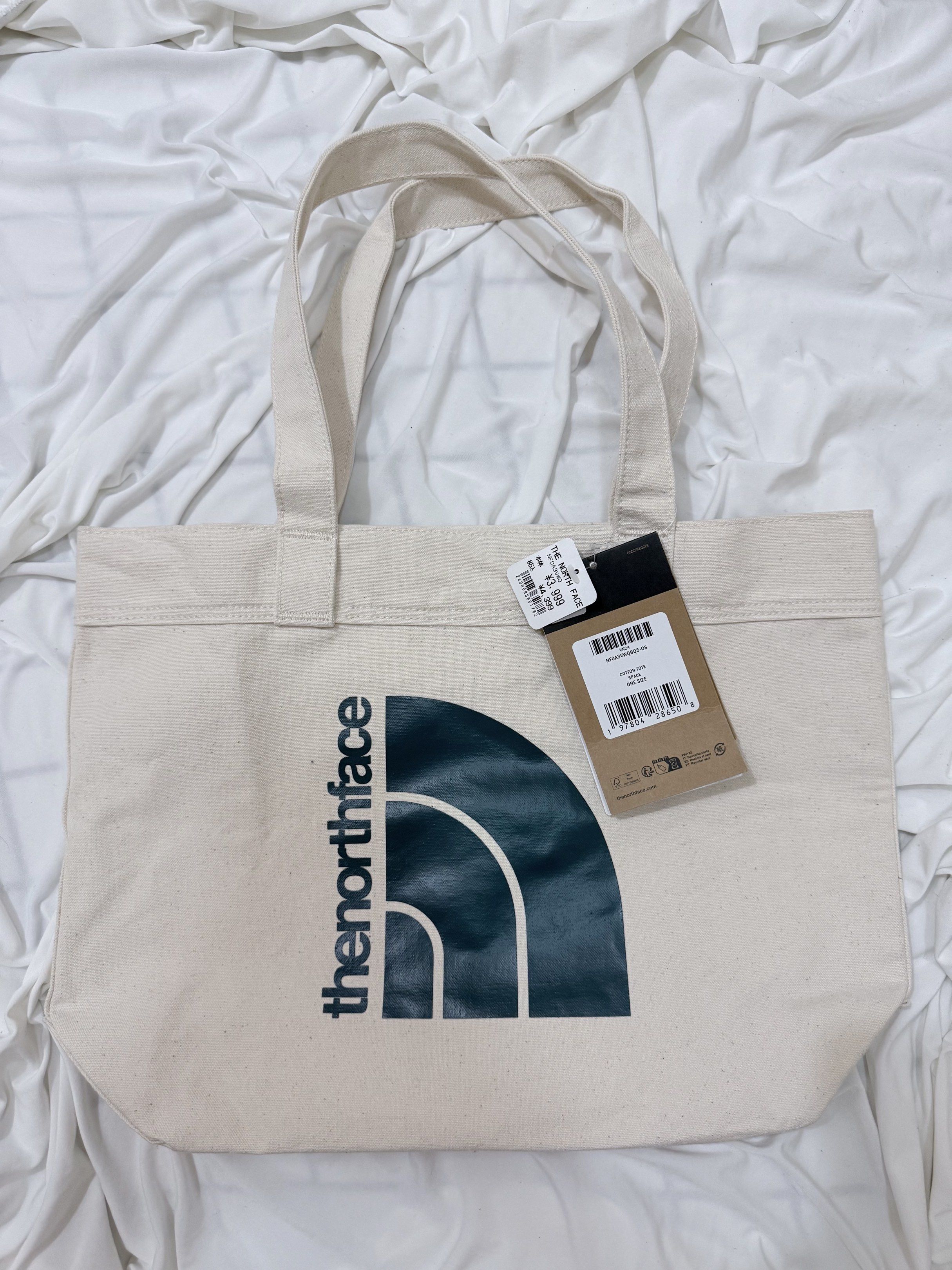 The North Face (TNF) Tote Bag (Category: Tote Bags) located in Quezon City. Submitted by lyelim (Listing ID 1417218493, Image 1). Description: Bought IMPULSIVELY in Japan, hehehehe. NEVER used. Selling it on a SLIGHTLY NEGOTIABLE price. ***Note: Jumbo TNF logo is in teal color.***.