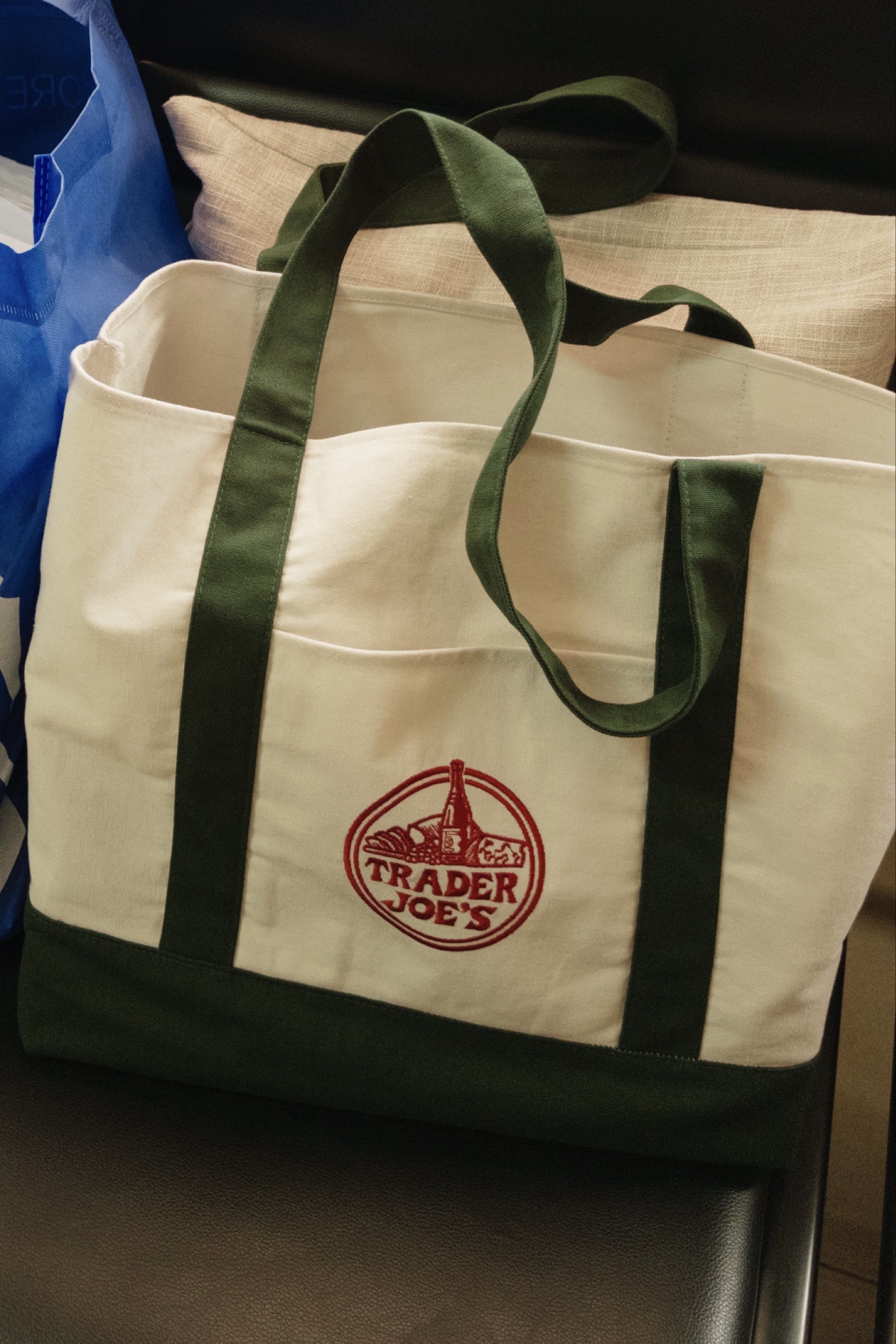 Trader Joe's Canvas Tote Bag (Category: Tote Bags) located in Roxas City. Submitted by exandwhy (Listing ID 1417217916, Image 3). Description: - Trader Joe's tote bag - Spacious main compartment - Front pocket - Classic white and green design - Features the Trader Joe's logo - Perfect for groceries, books, or everyday essentials - Includes tag.