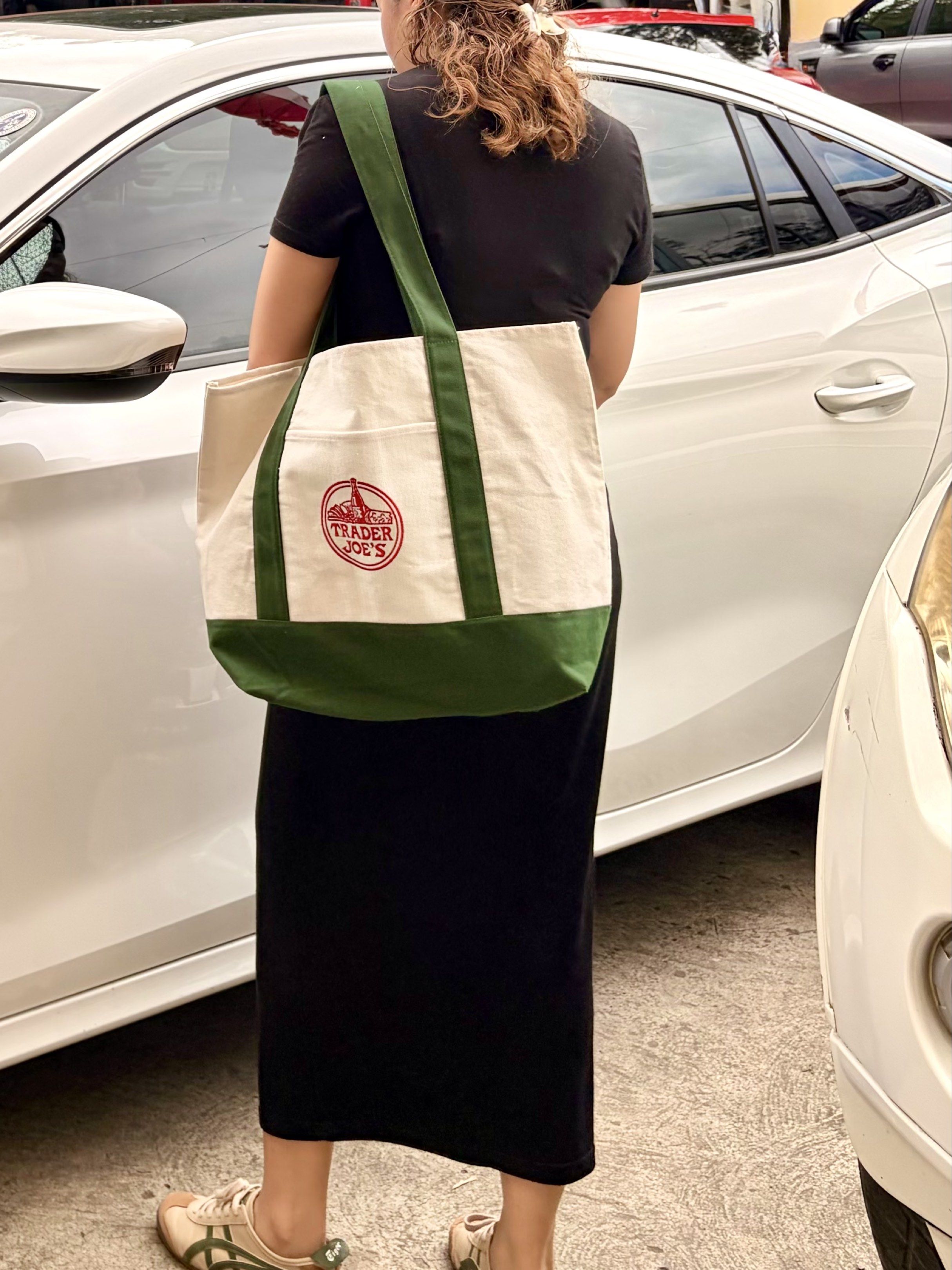Trader Joe's Canvas Tote Bag (Category: Tote Bags) located in Roxas City. Submitted by exandwhy (Listing ID 1417217916, Image 2). Description: - Trader Joe's tote bag - Spacious main compartment - Front pocket - Classic white and green design - Features the Trader Joe's logo - Perfect for groceries, books, or everyday essentials - Includes tag.