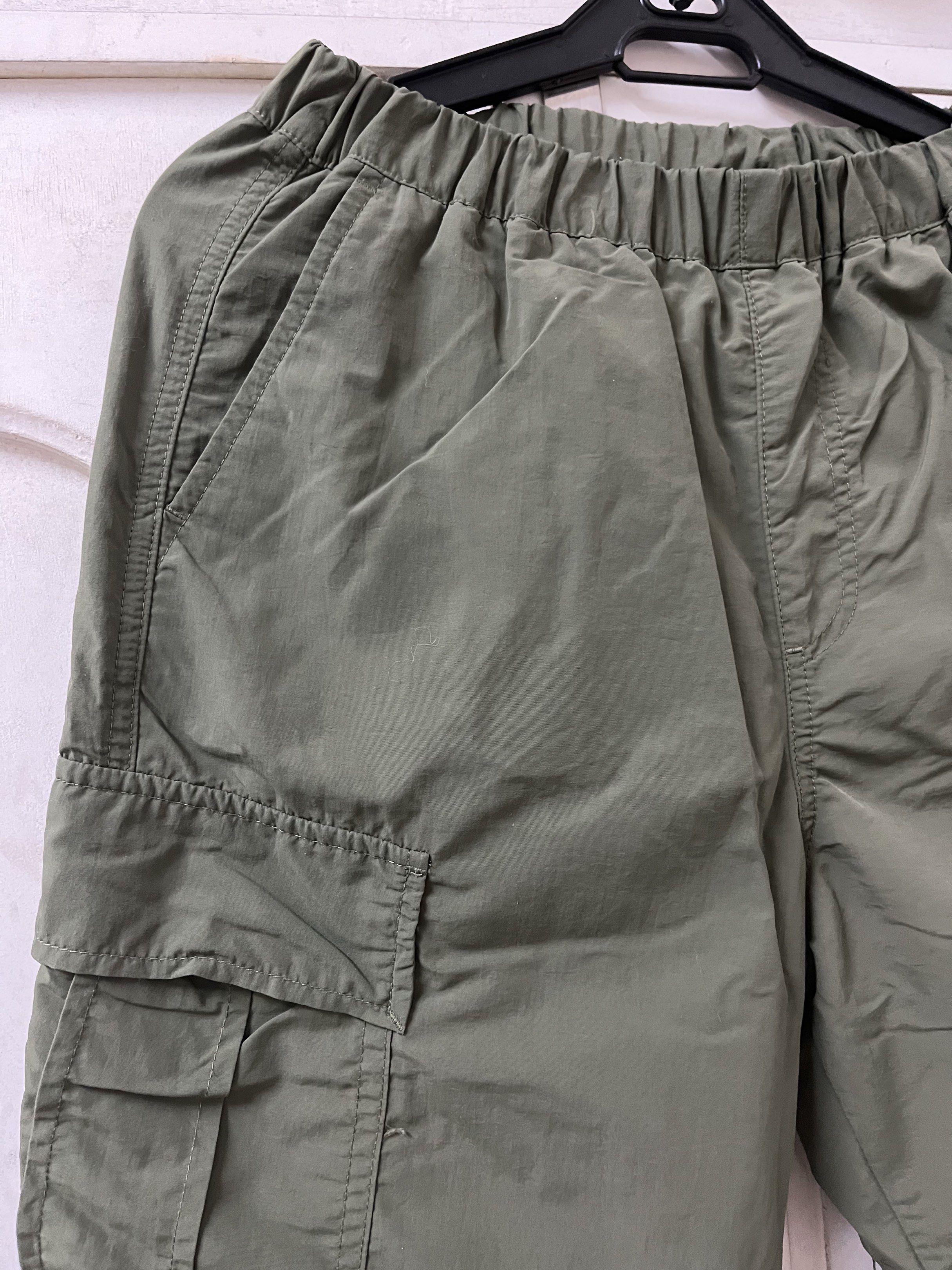 Uniqlo Cargo Pants - Size 140 (Category: Babies & Kids Fashion) located in Marikina City. Submitted by hello-yellow (Listing ID 1417348841, Image 2). Description: - Uniqlo olive green cargo pants - Size: 140 on tag. Actual waist 22-30 inches, gartered and adjustable waist. - Length 32 inches. - Color: Olive Green - Features multiple pockets - Elastic waistband - Relaxed fit - Elastic ankles - Lightweight material - Suitable for casual wear For 8-