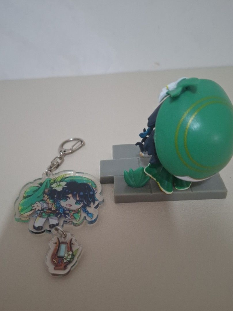 Venti figurine with keychain Genshin Impact (Category: Figurines & Statues) located in Tacloban City. Submitted by cheebamay (Listing ID 1417290001, Image 2). Description: loc: tacloban city - figurine and acrylic keychain - venti from genshin impact issue: figurine moves a slight back (see last pic).
