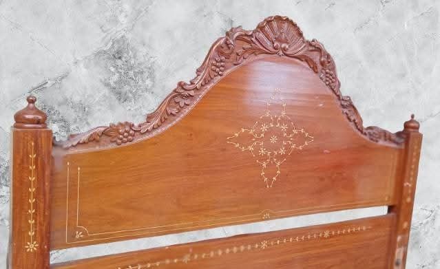 Super Double Vintage Solid Narra Wood Bed Frame (Category: Bed Frames & Mattresses) located in Quezon City. Submitted by allboutbeautyofyome (Listing ID 1417368868, Image 1). Description: - Rare red Narra wood bed frame - Authentic Solihiya (Abaca grass cane) woven bed - Beautifully carved headboard with acanthus and grapes design - Luxurious bone inlay details - Made from a rare, uncut Narra wood slab -Sturdy Unique and refine 🙅‍♀️Strictly No c