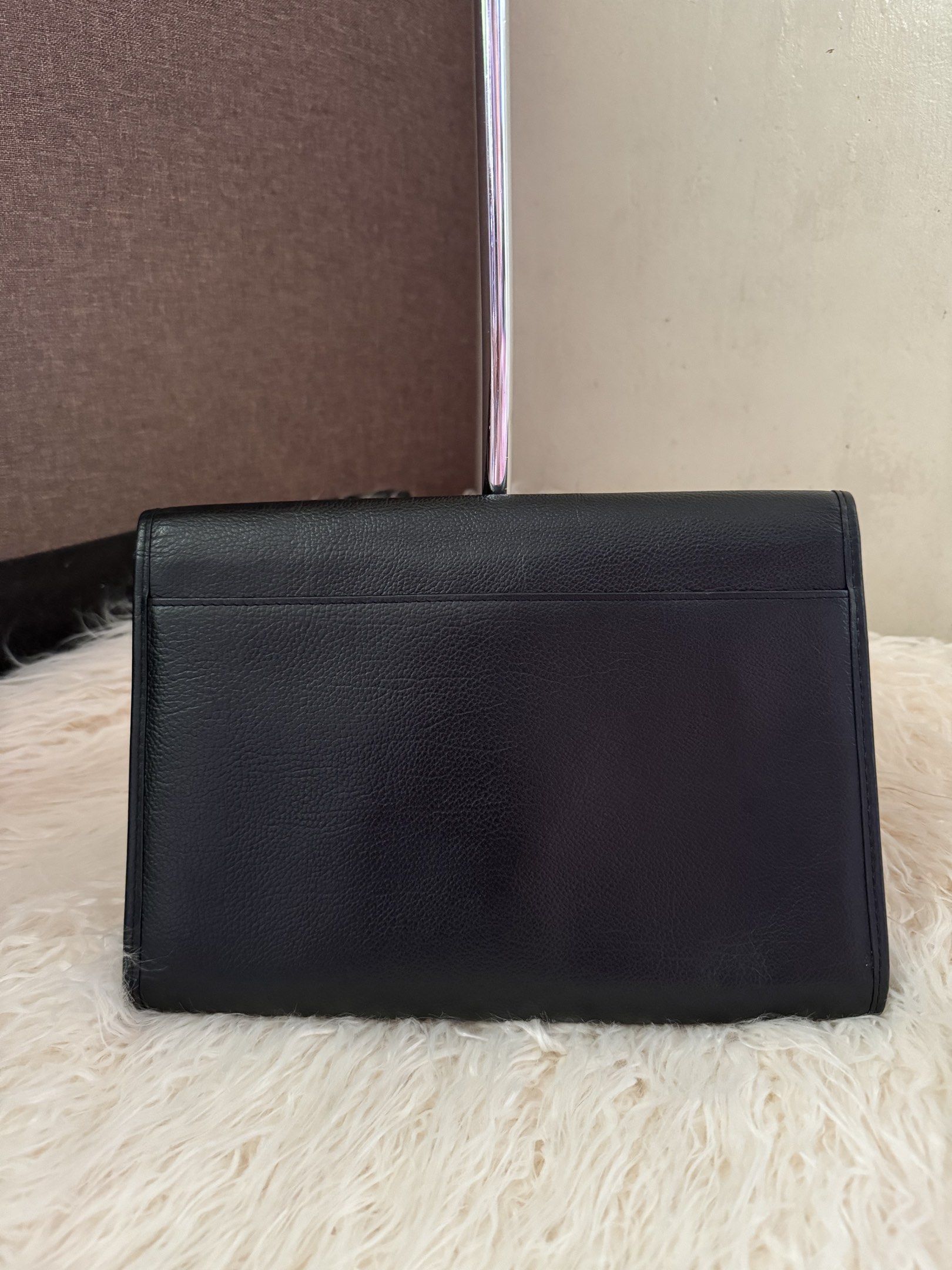 YSL Clutch Bag (Category: Luxury Bags & Wallets) located in Cavite. Submitted by japan_vintage_bags (Listing ID 1417402181, Image 3). Description: Authentic YSL Clutch Bag in black leather Japan Sourced No cracks, no glazing issue, no rubbings Leather is in excellent condition, no stains, no discoloration Clean interior, no foul smell Money back guarantee if proven fake Measurement: Length: 10.5” Height: 7” Width: 1” ***You can put a pouch with c