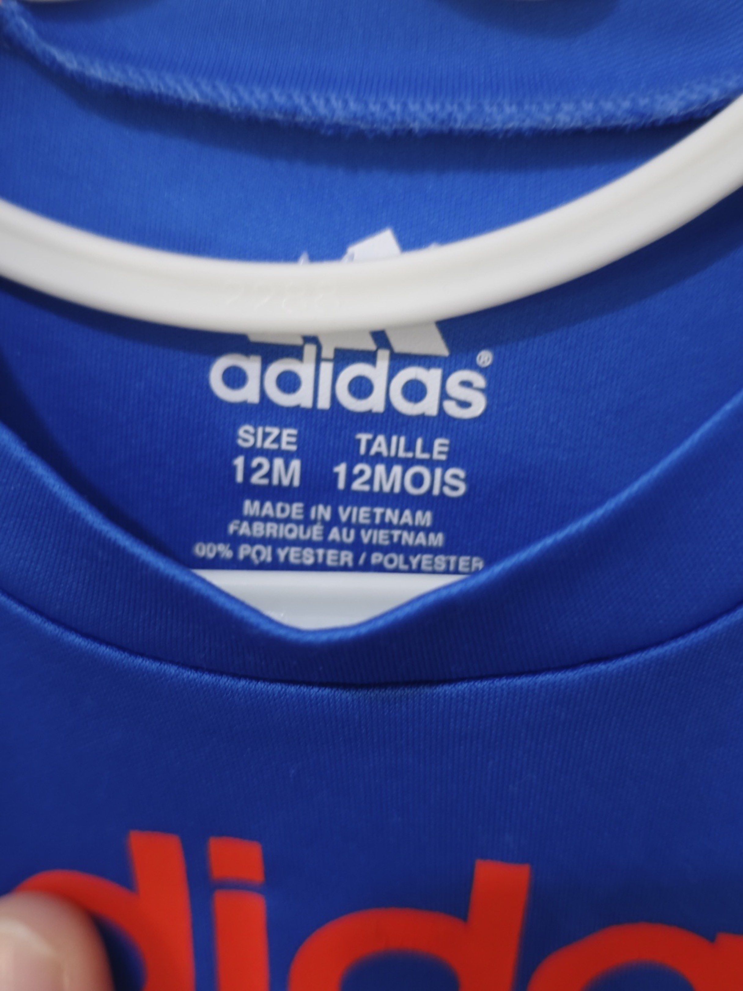 Adidas Blue T-shirt 12M (Category: Babies & Kids Fashion) located in Paranaque City. Submitted by serendipity1021 (Listing ID 1417494827, Image 2). Description: - Adidas baby t-shirt - Size: 12 months - Color: Blue with red "adidas" logo - Accents: Navy shoulders, orange bottom - Material: 100% polyester - Made in Vietnam.