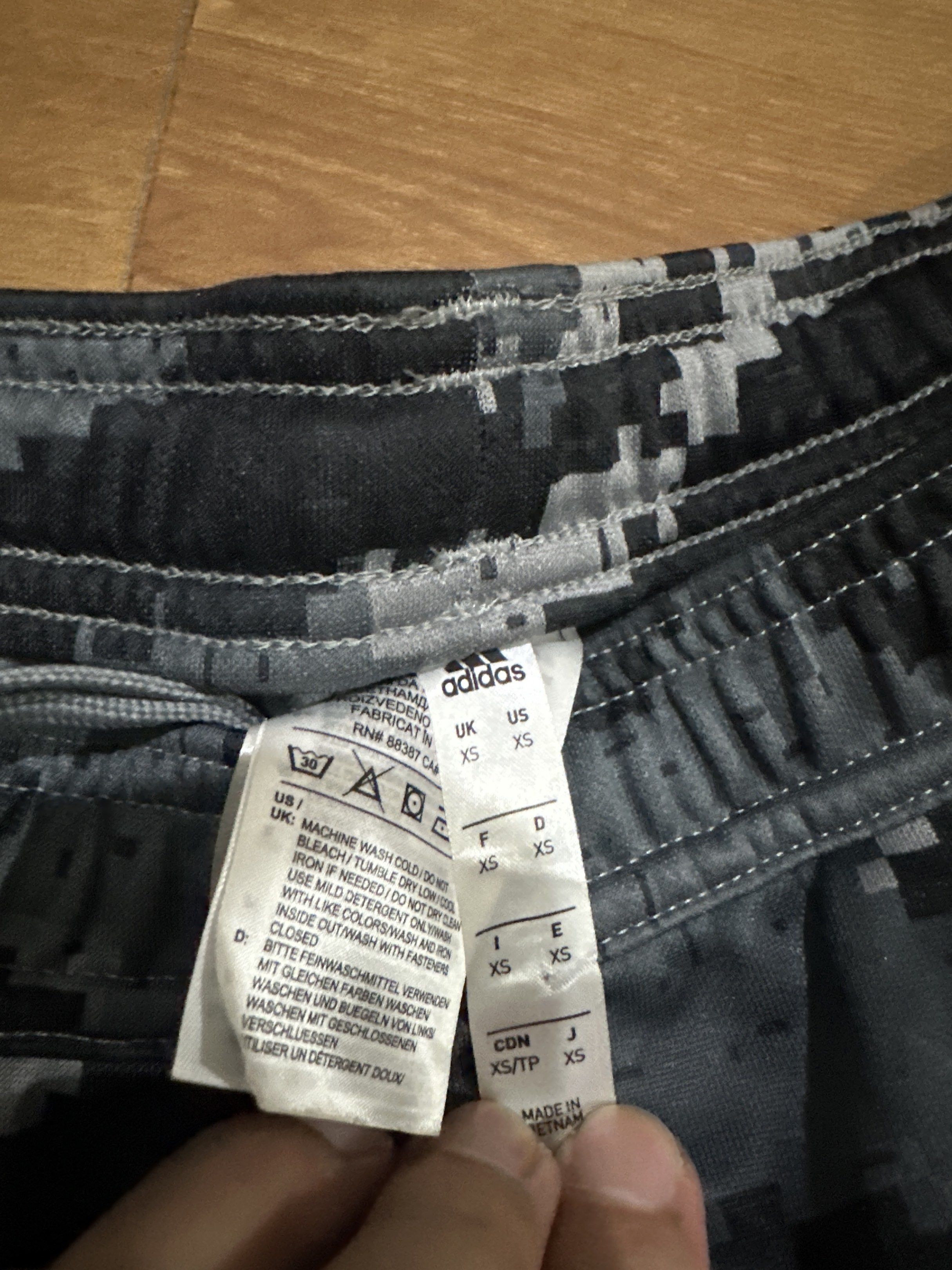 Adidas Camo Track Pants XS (Category: Joggers) located in Pasig City. Submitted by jhadsan (Listing ID 1417474492, Image 2). Description: - Adidas track pants - Digital camo pattern - Adidas logo detail - Iconic three white stripes - Drawstring waist - Size: XS - Made in Vietnam.