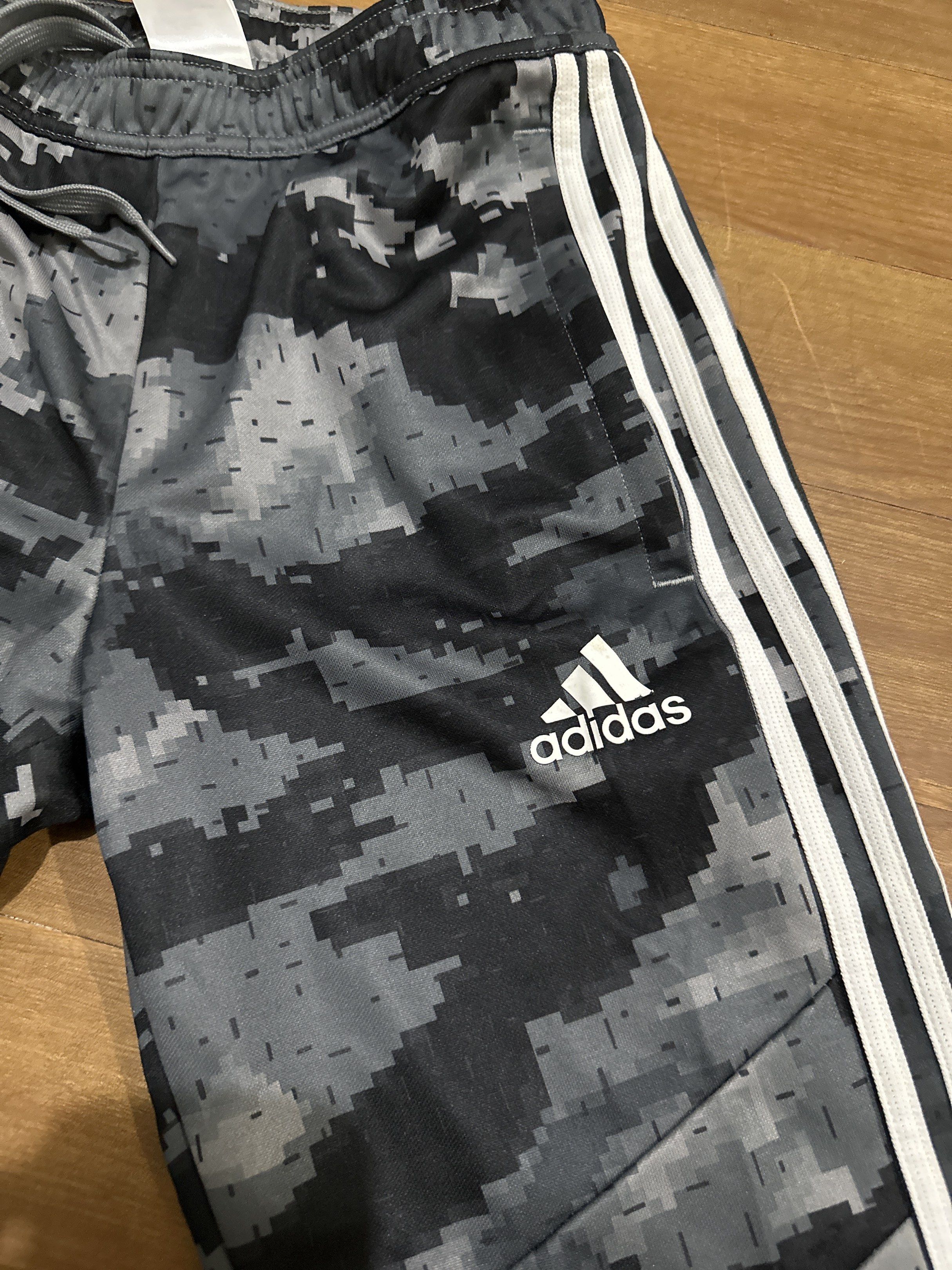 Adidas Camo Track Pants XS (Category: Joggers) located in Pasig City. Submitted by jhadsan (Listing ID 1417474492, Image 3). Description: - Adidas track pants - Digital camo pattern - Adidas logo detail - Iconic three white stripes - Drawstring waist - Size: XS - Made in Vietnam.