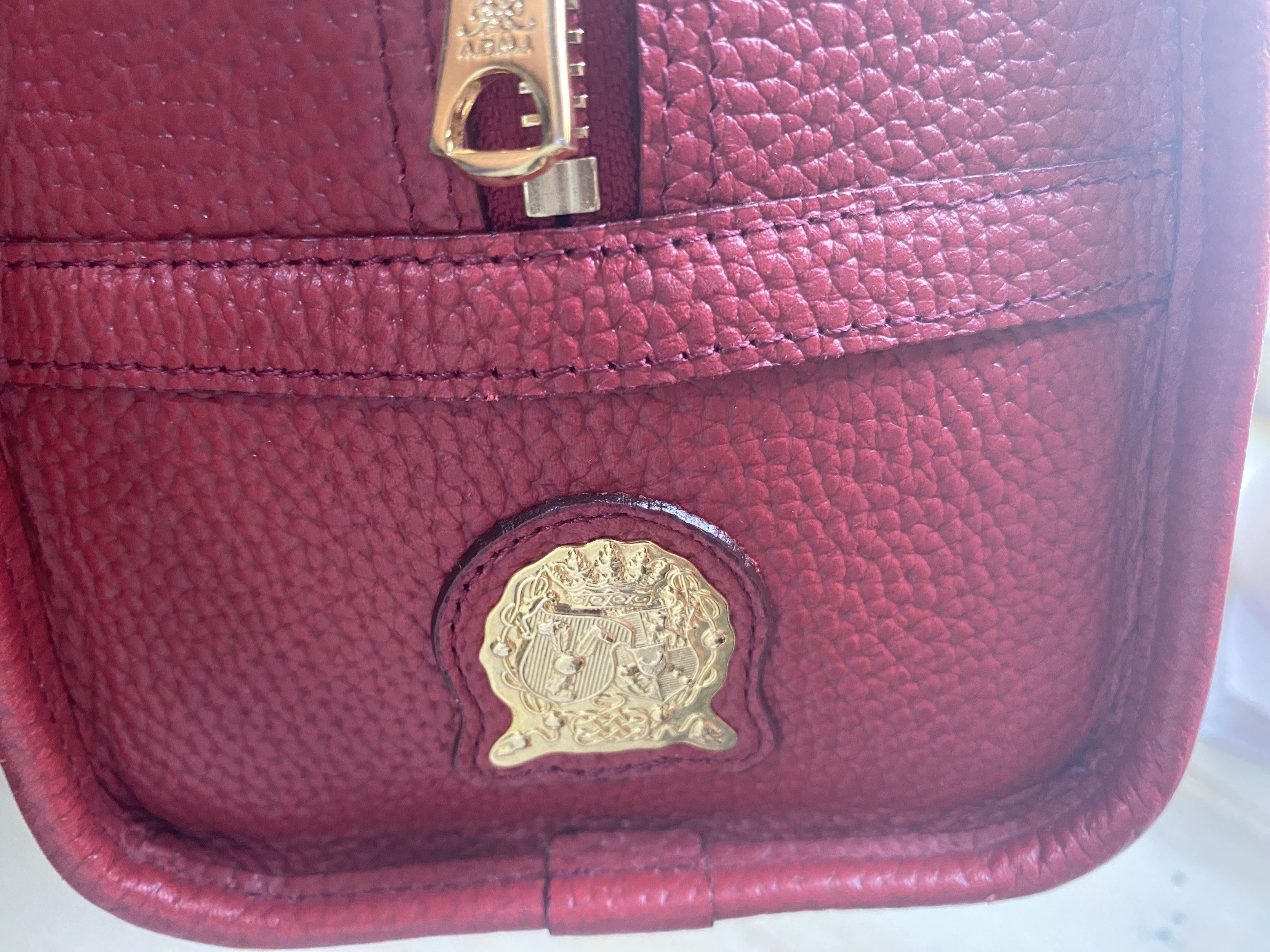 A.D.M.J. Red Leather Handbag (Category: Luxury Bags & Wallets) located in Quezon City. Submitted by mcva2 (Listing ID 1417416297, Image 1). Description: - A.D.M.J. handbag in vibrant red leather - Elegant gold-tone zipper and hardware - Interior lined with luxurious blue fabric - Includes a stylish matching leather tag - Structured shape with comfortable top handles - Authentic brand logo displayed prominently - it was a gift never been used just