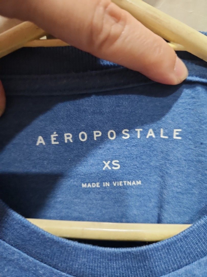 Aeropostale American Flag Tee - XS (Category: Shirts) located in Manila. Submitted by juneuy (Listing ID 1417504510, Image 2). Description: - Aeropostale t-shirt - Features an American flag design - 'AERO' printed vertically on the left side - Crew neck style - Size: XS - Made in Vietnam.