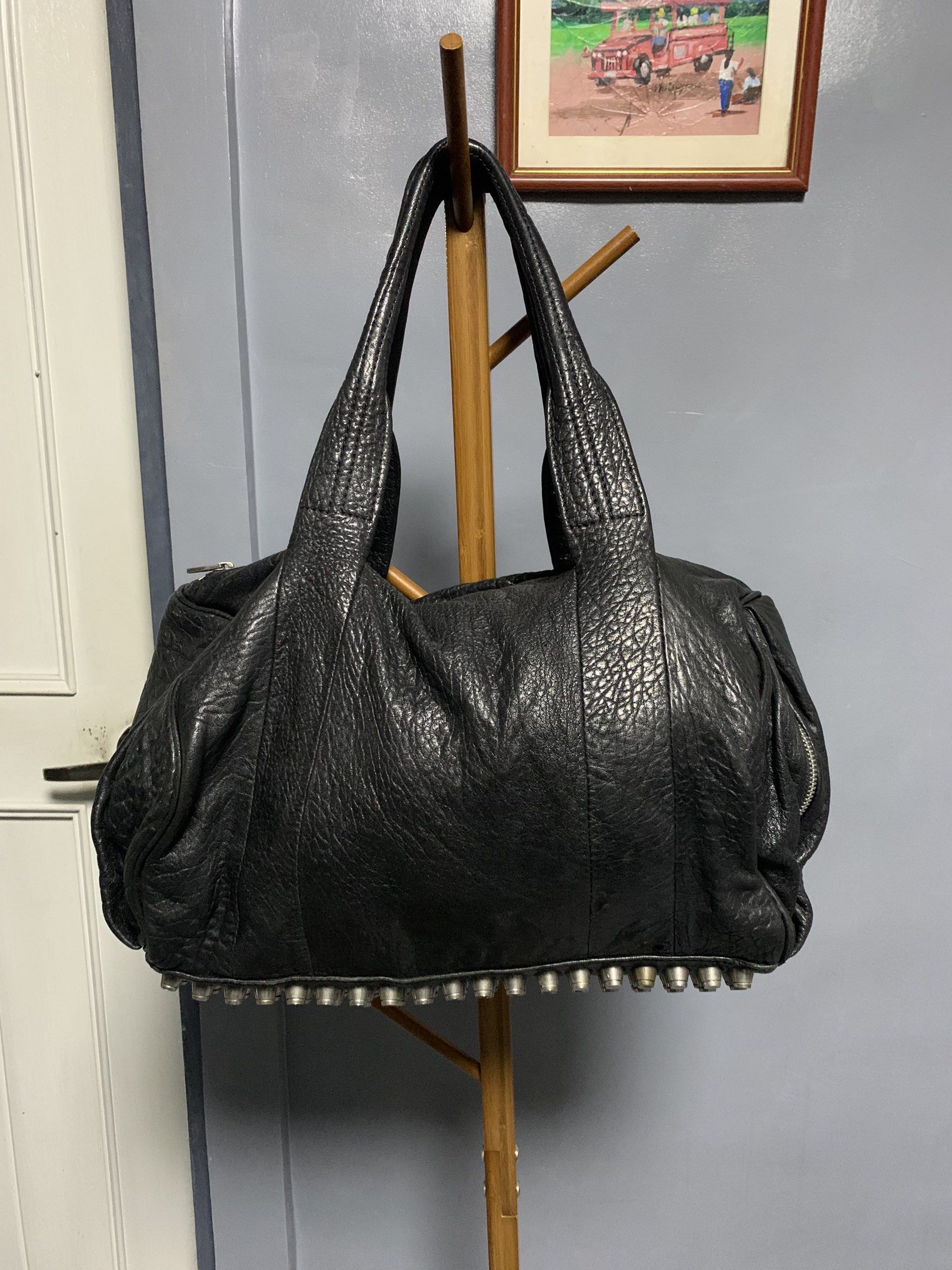 Alexander Wang Rocco Bag - Medium/Large (Category: Luxury Bags & Wallets) located in Quezon City. Submitted by carmeladelacruz82 (Listing ID 1417563059, Image 1). Description: - AUTHENTIC Alexander Wang Rocco Bag - Color: Black - Material: Leather - Condition: no major flaws; walang punit sa leather - Issue: small rip in the lining sa loob ng bag but barely noticeable.